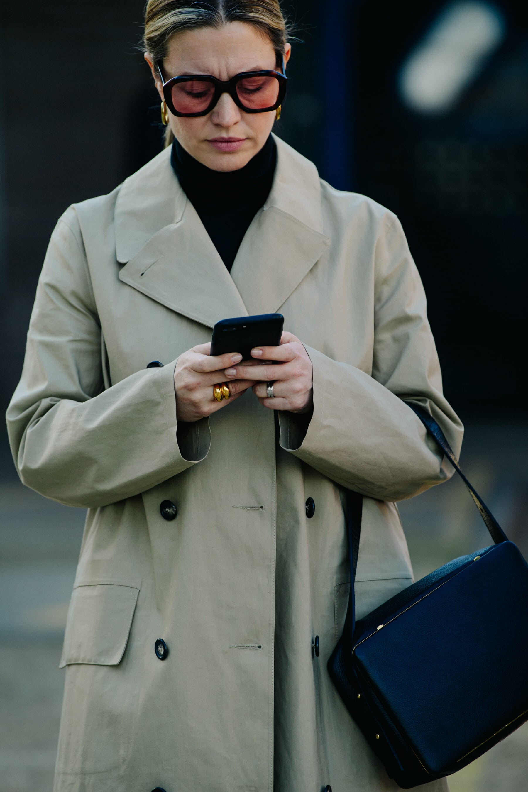 Woman wearing pale coat