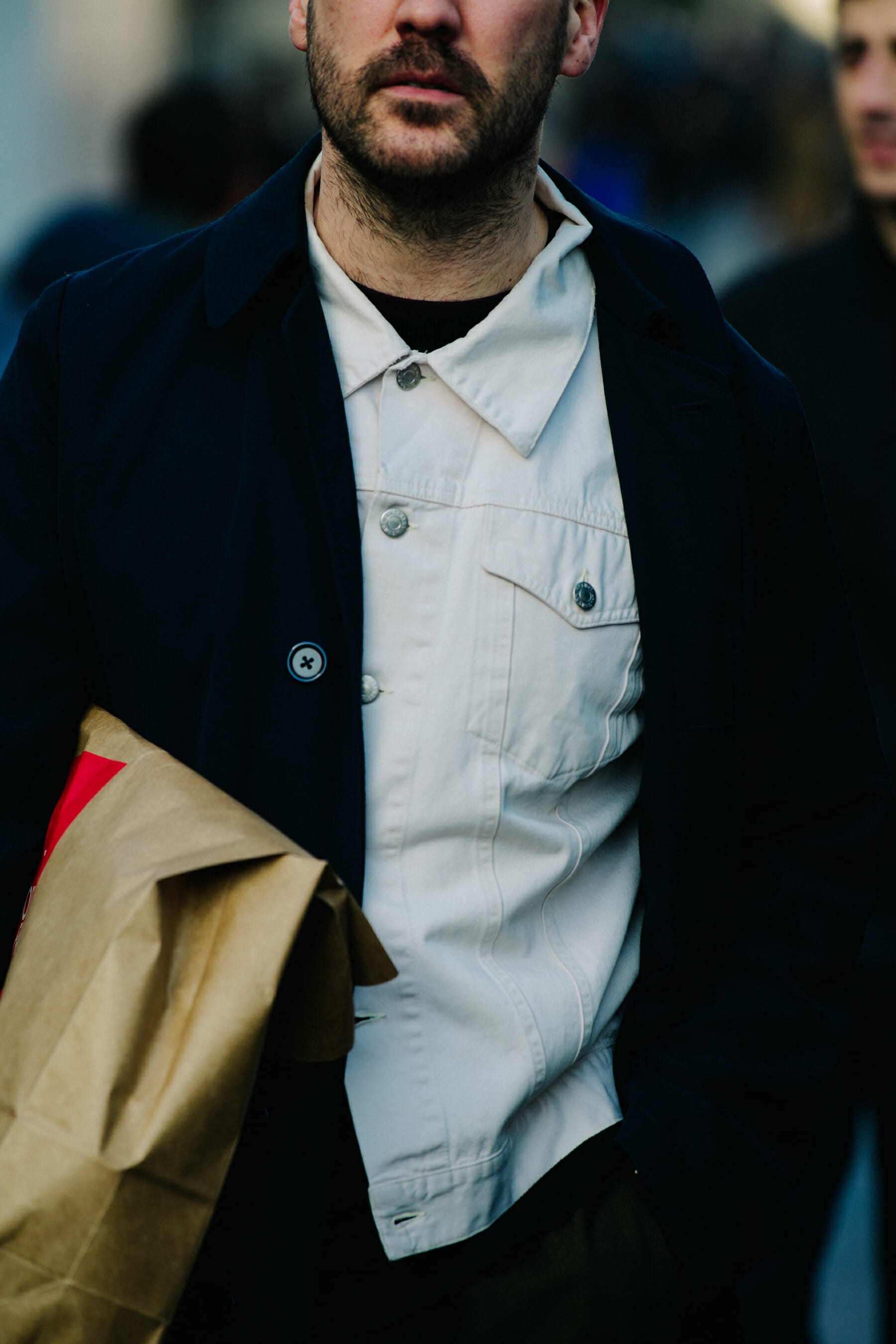 Man wearing white denim jacket