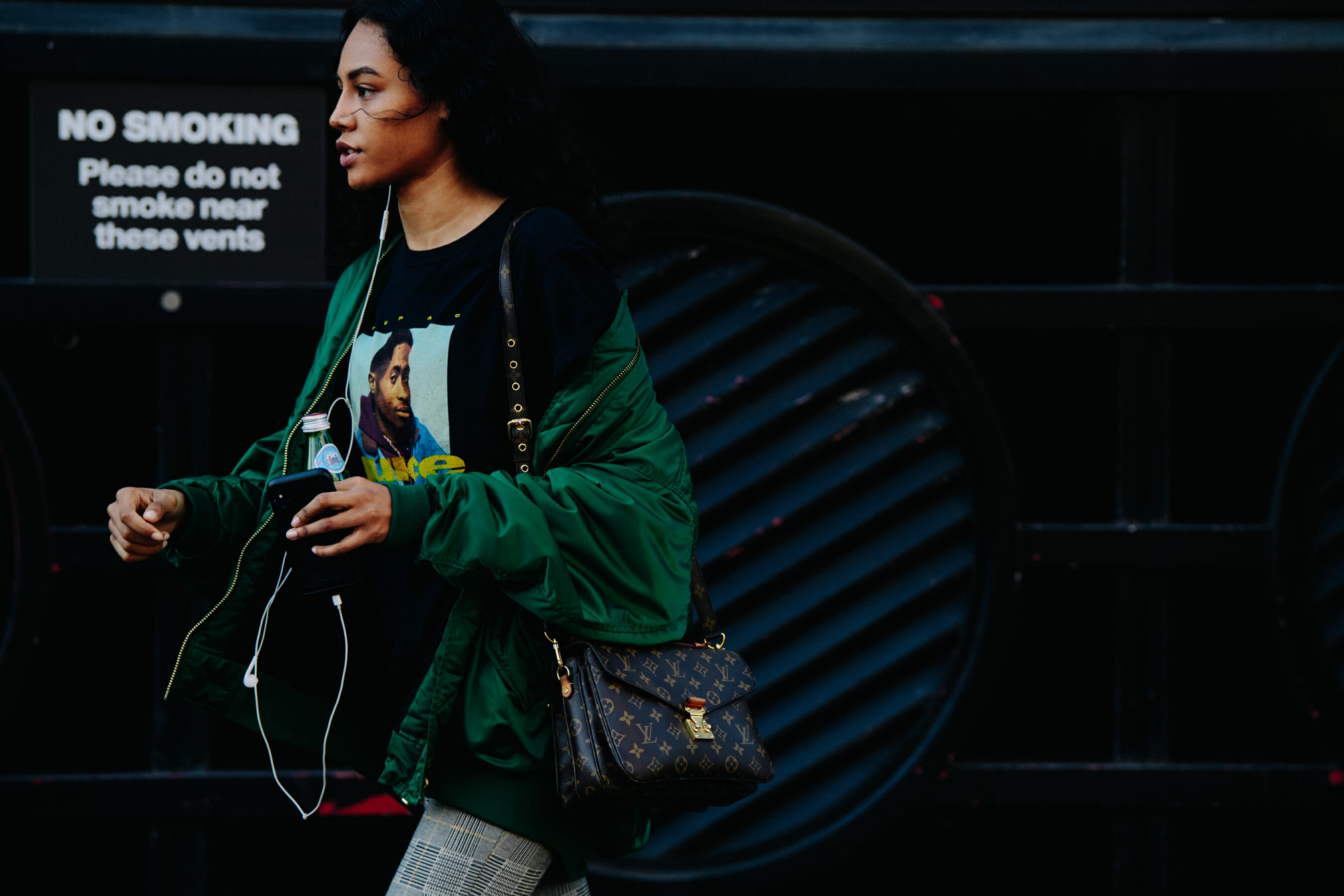 Model wearing green bomber jacket