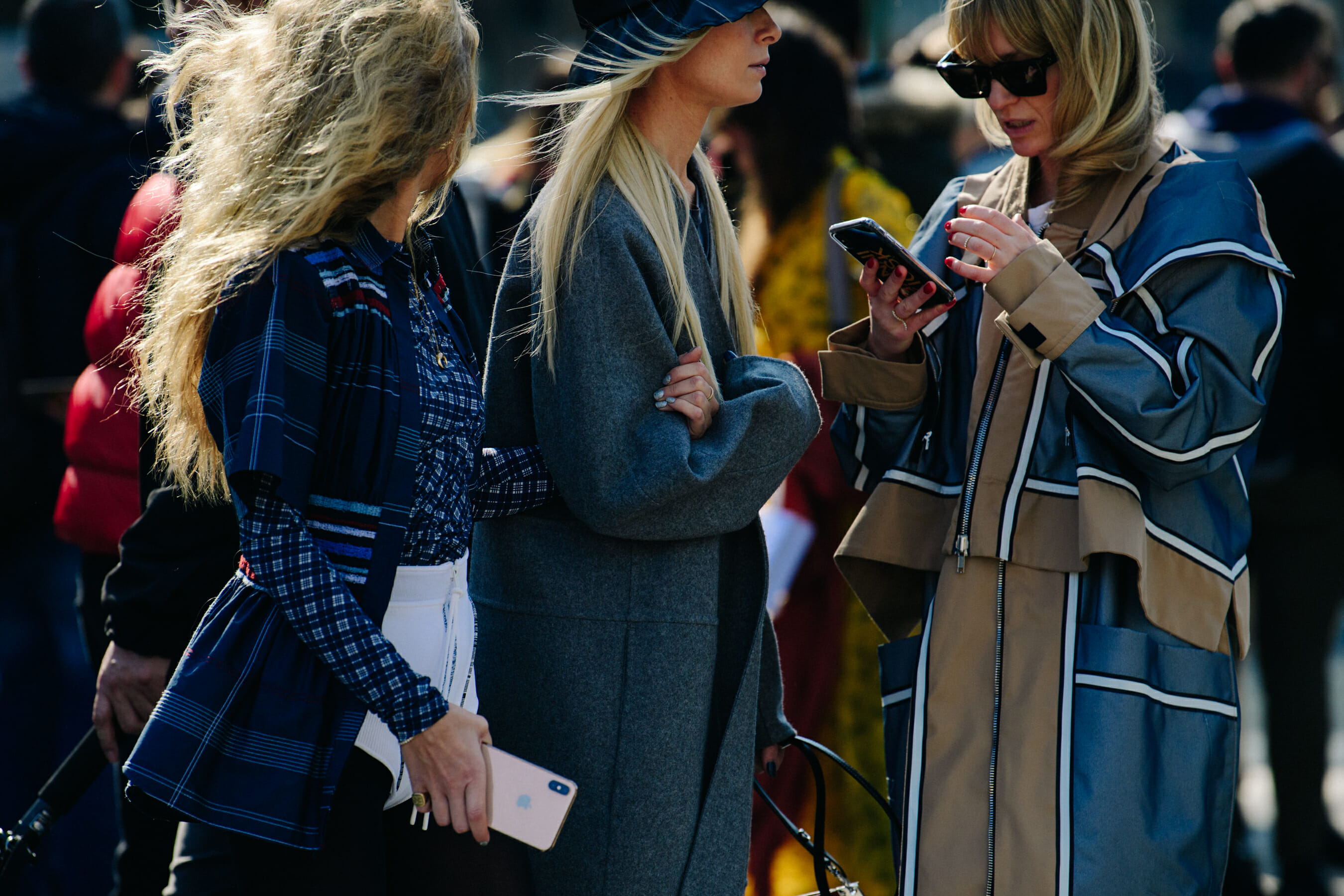 Three Danish women wearing long coats