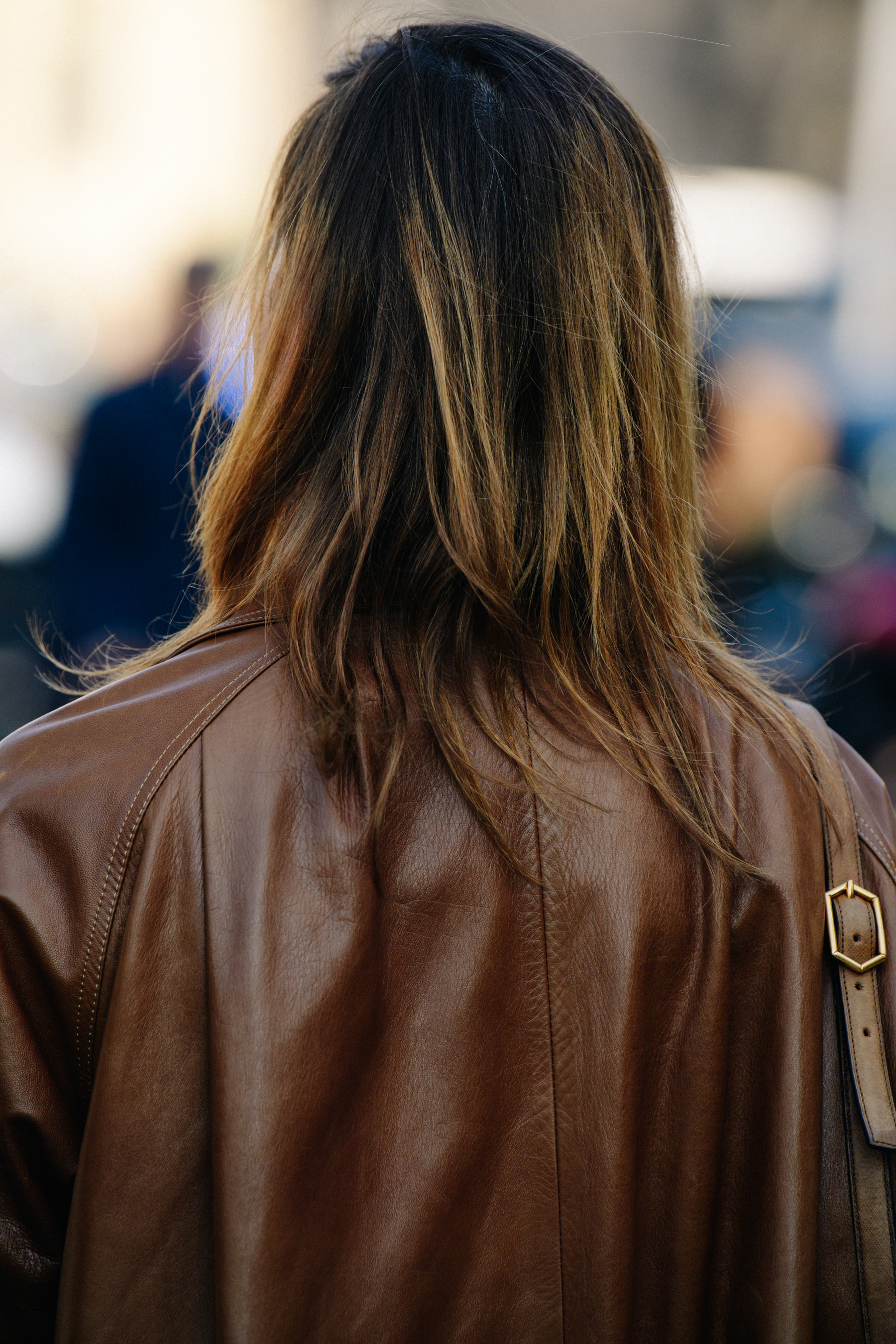 Woman wearing brown leather jacket