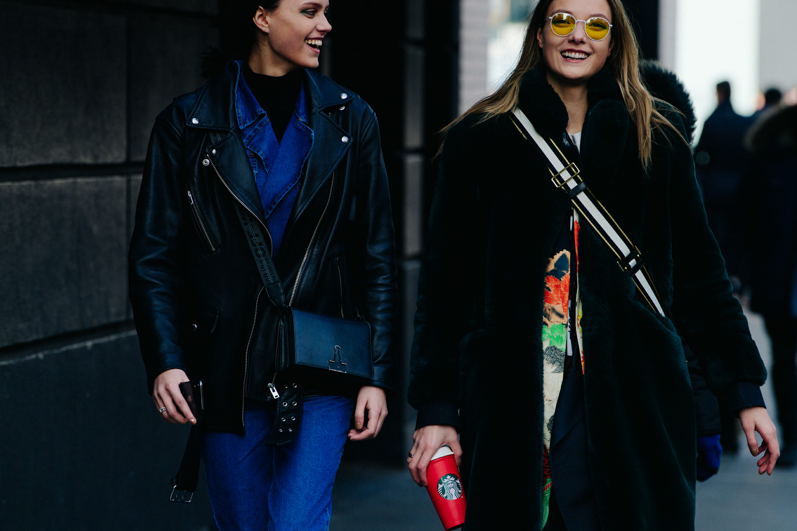 Two models wearing dark colours