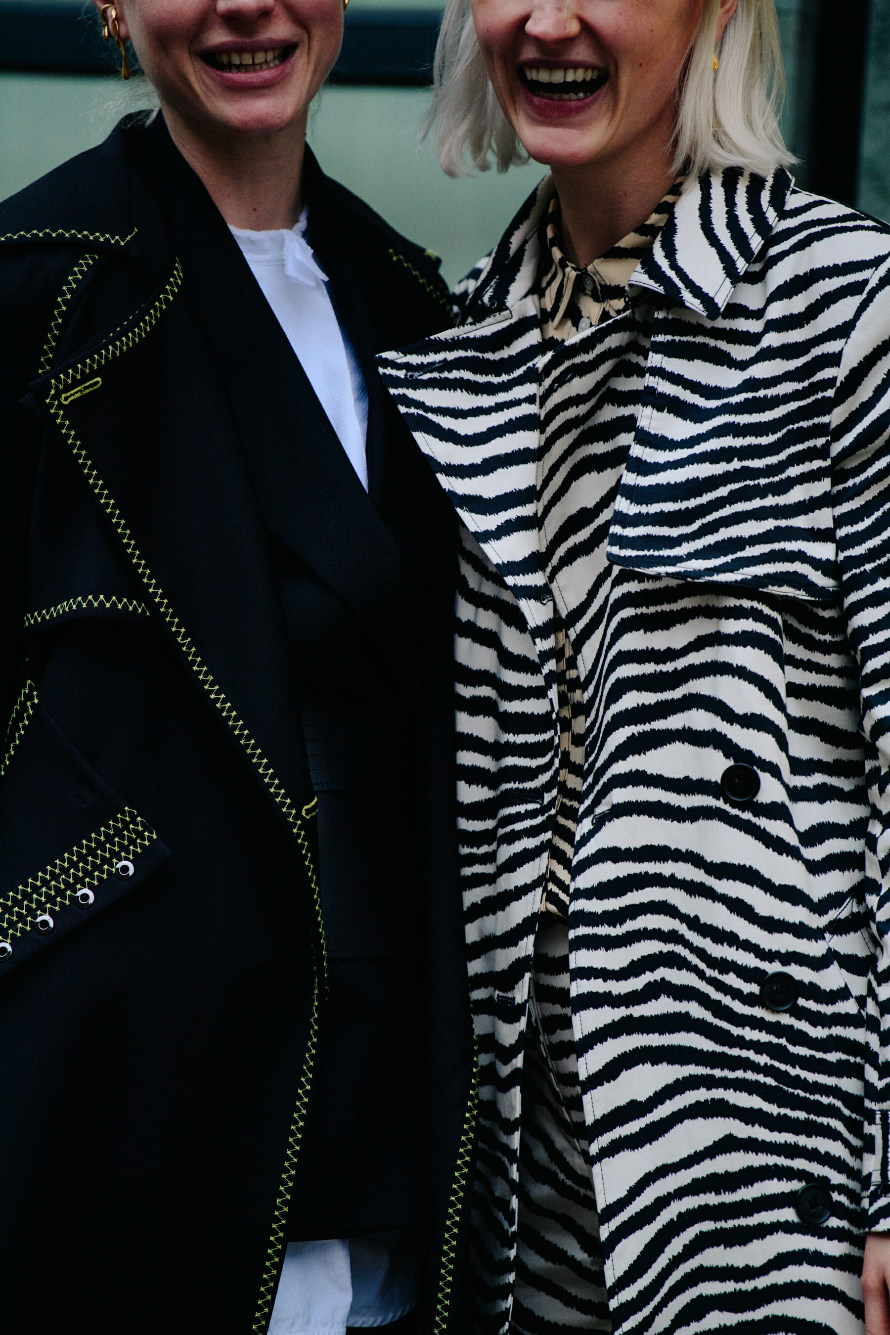 Two women wearing black and white