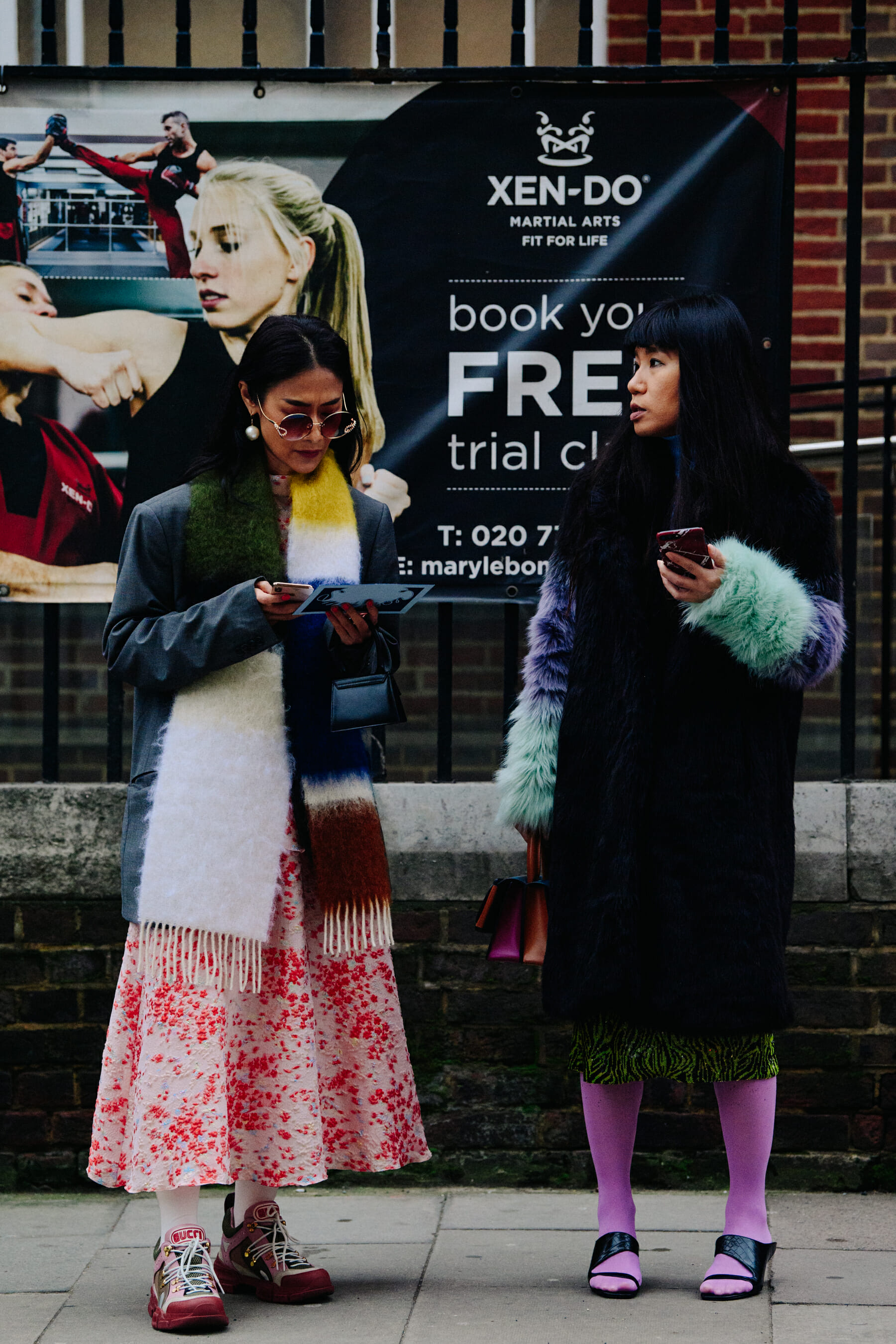 Two women wearing colourful outfits