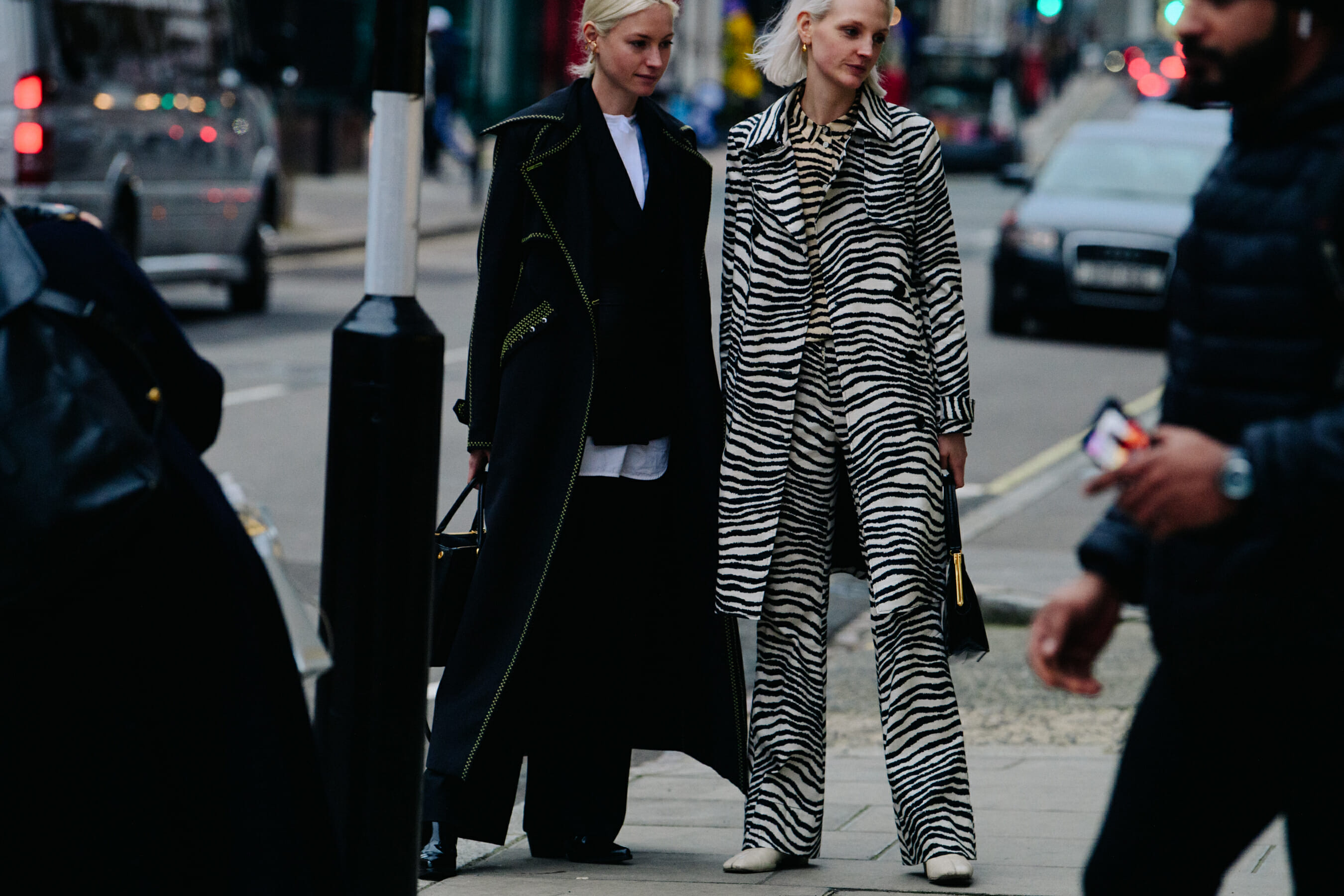Two women wearing black and white