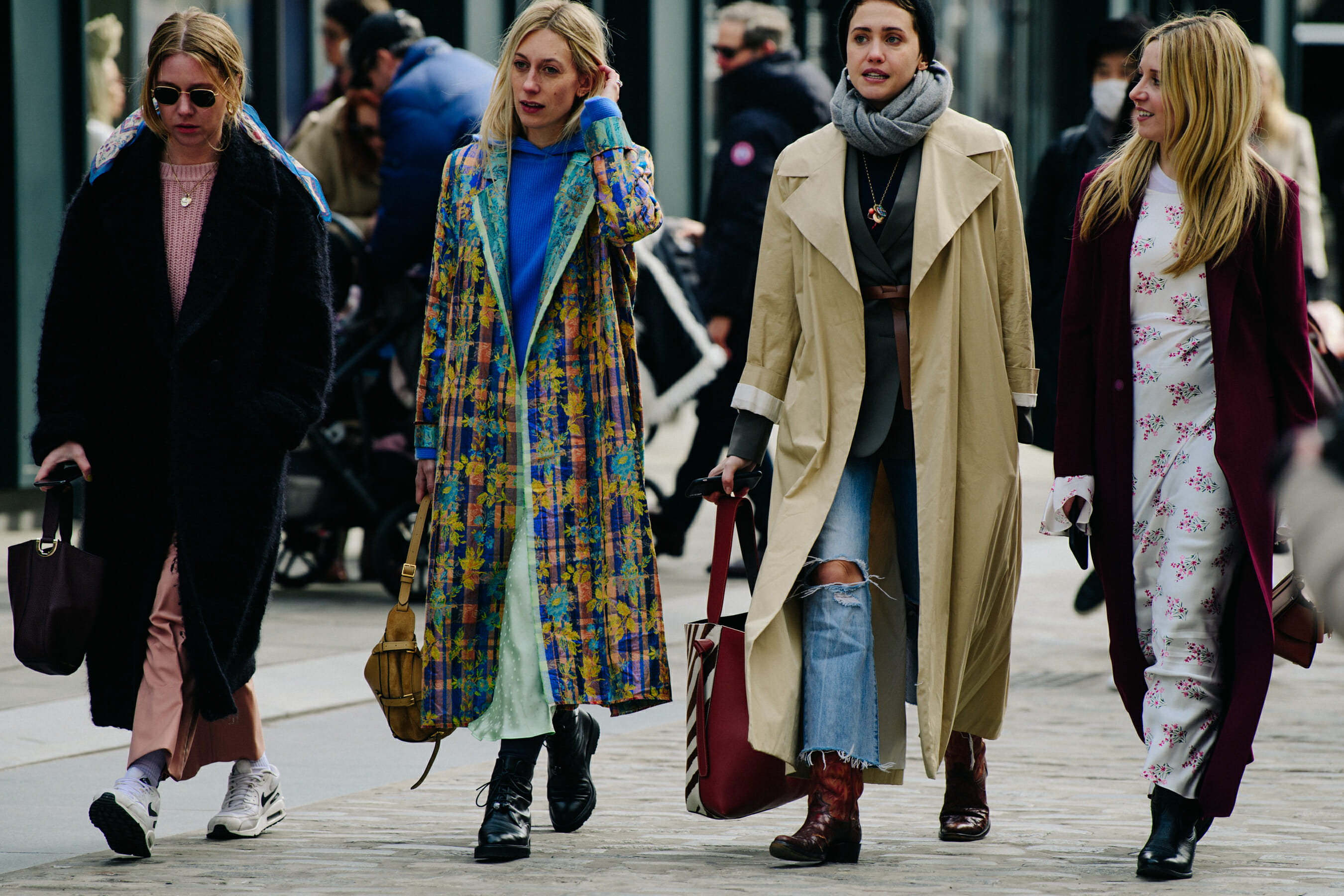 Four women wearing stylish clothing