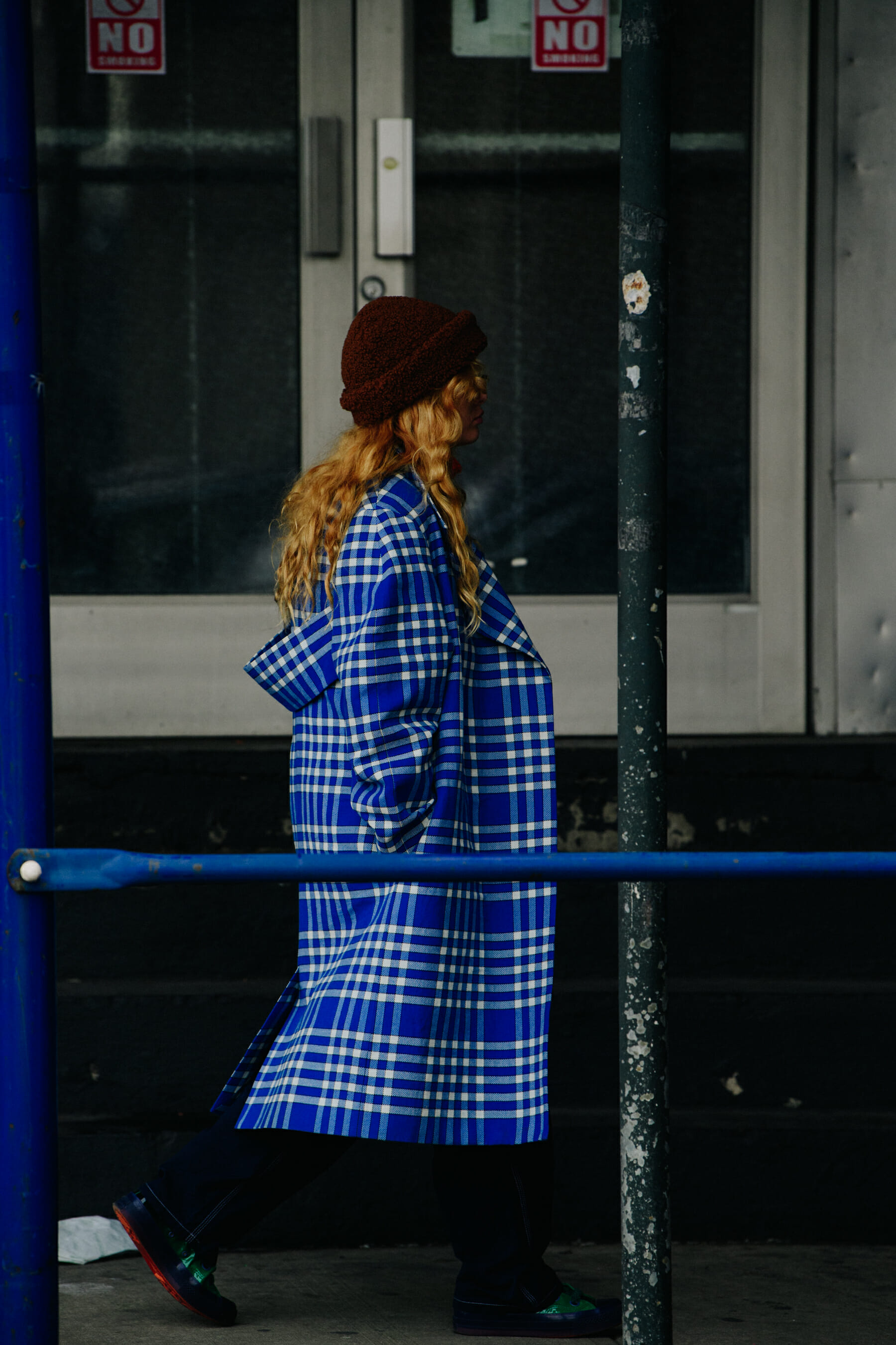Woman wearing blue check coat
