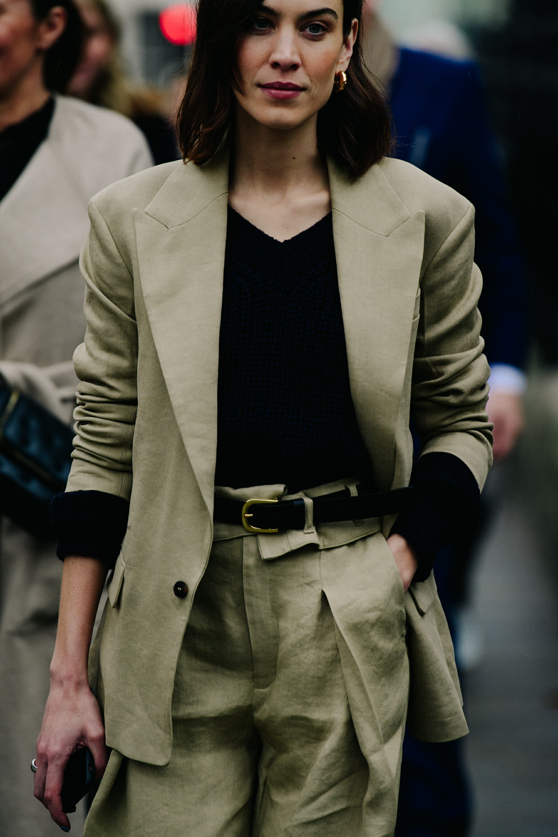 British model wearing tan suit