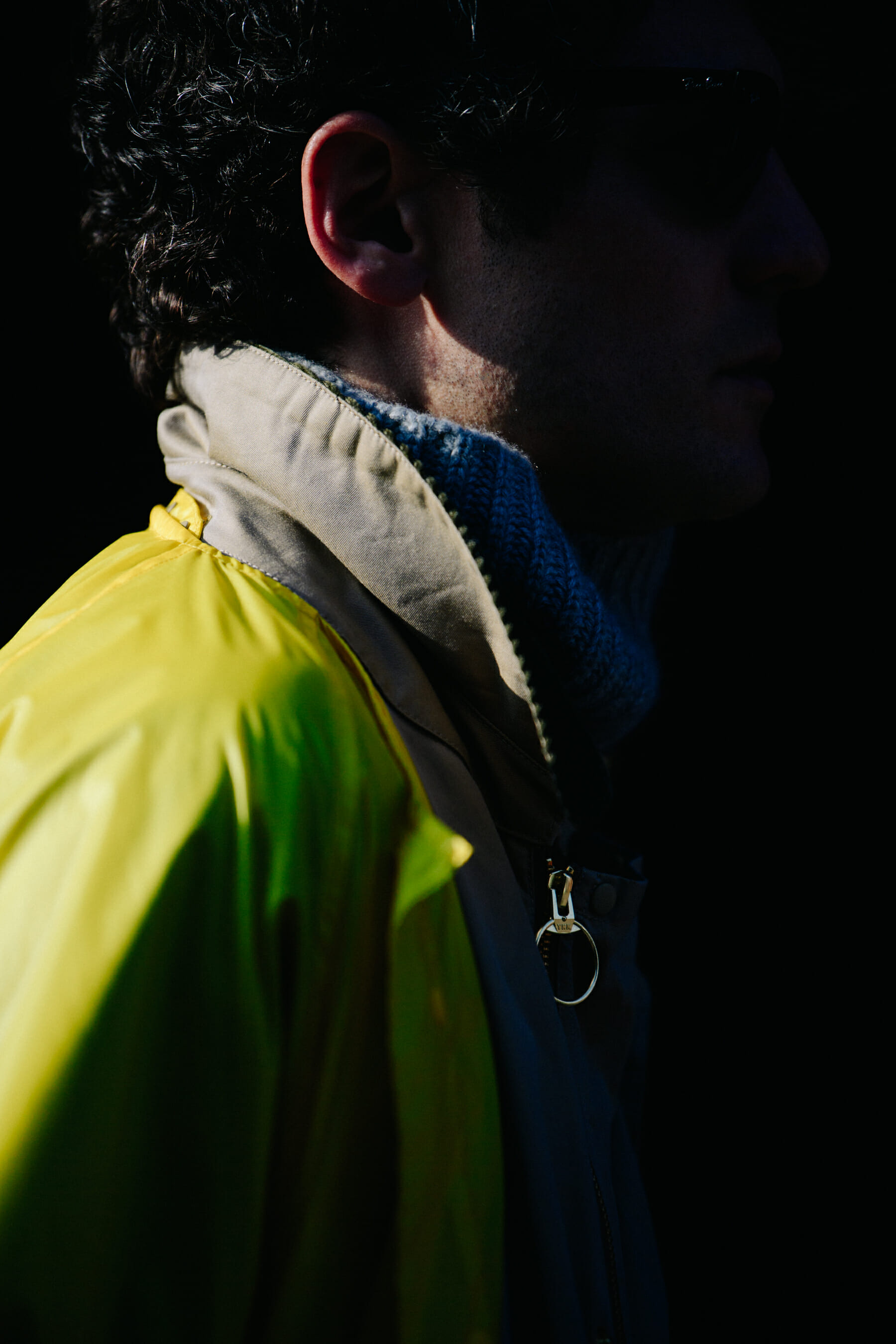 Man wearing yellow and tan jacket