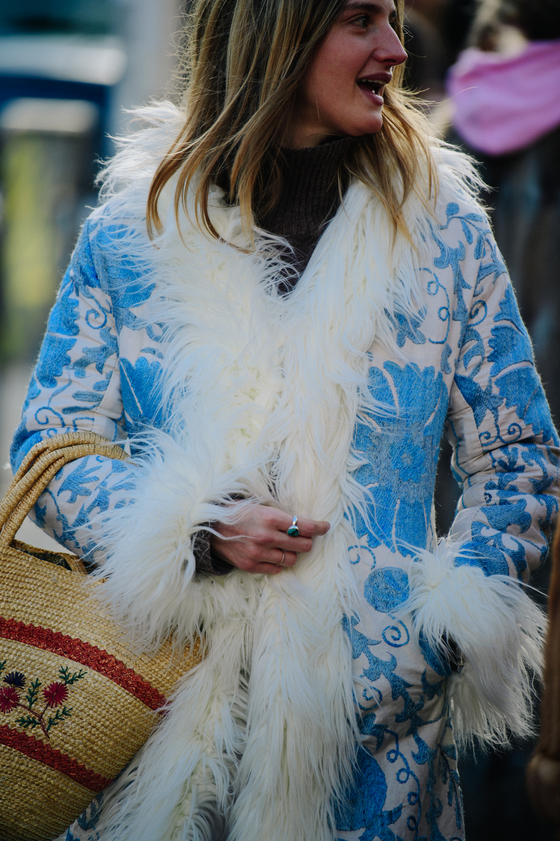 Woman wearing blue furry coat