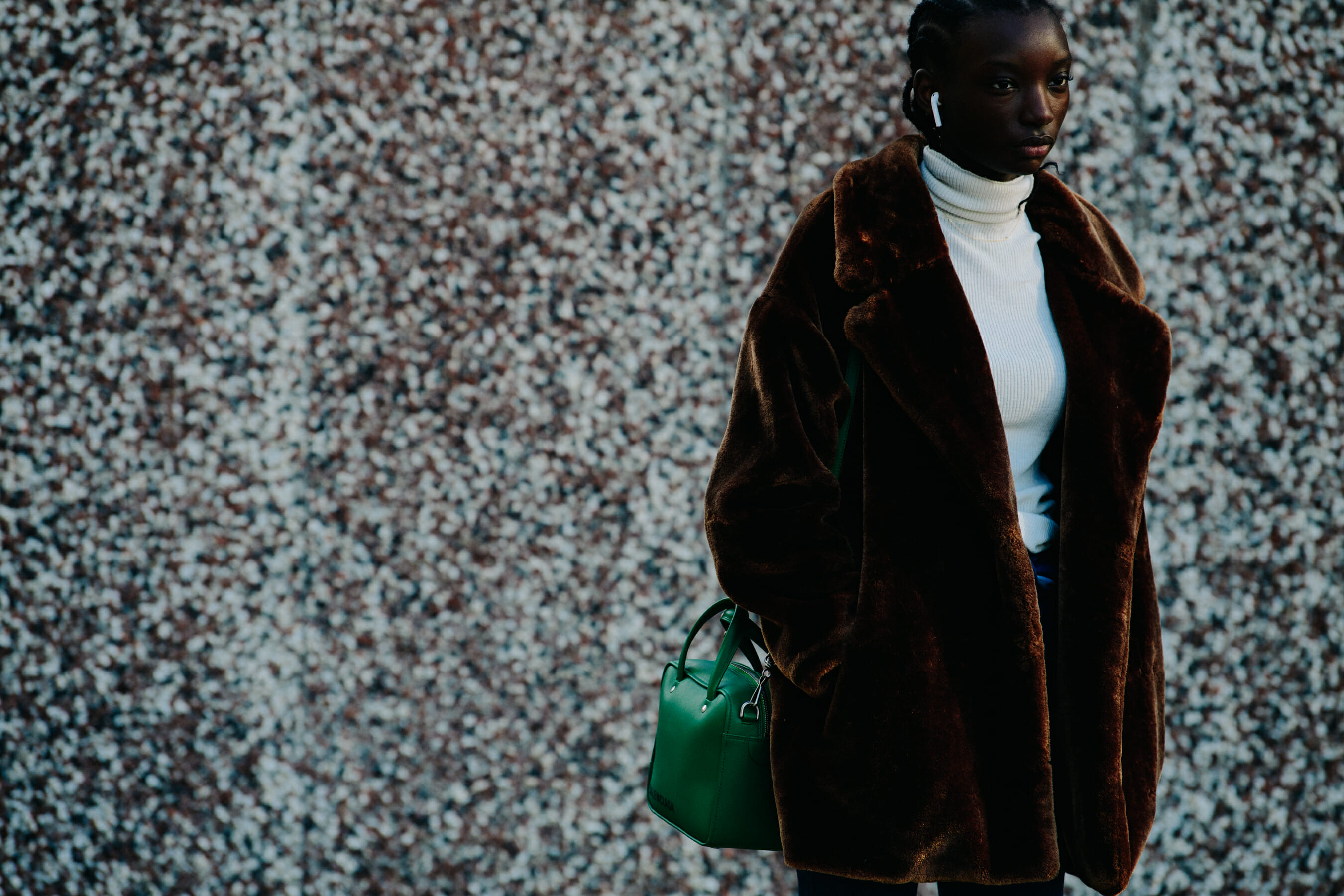 Model wearing brown fur coat