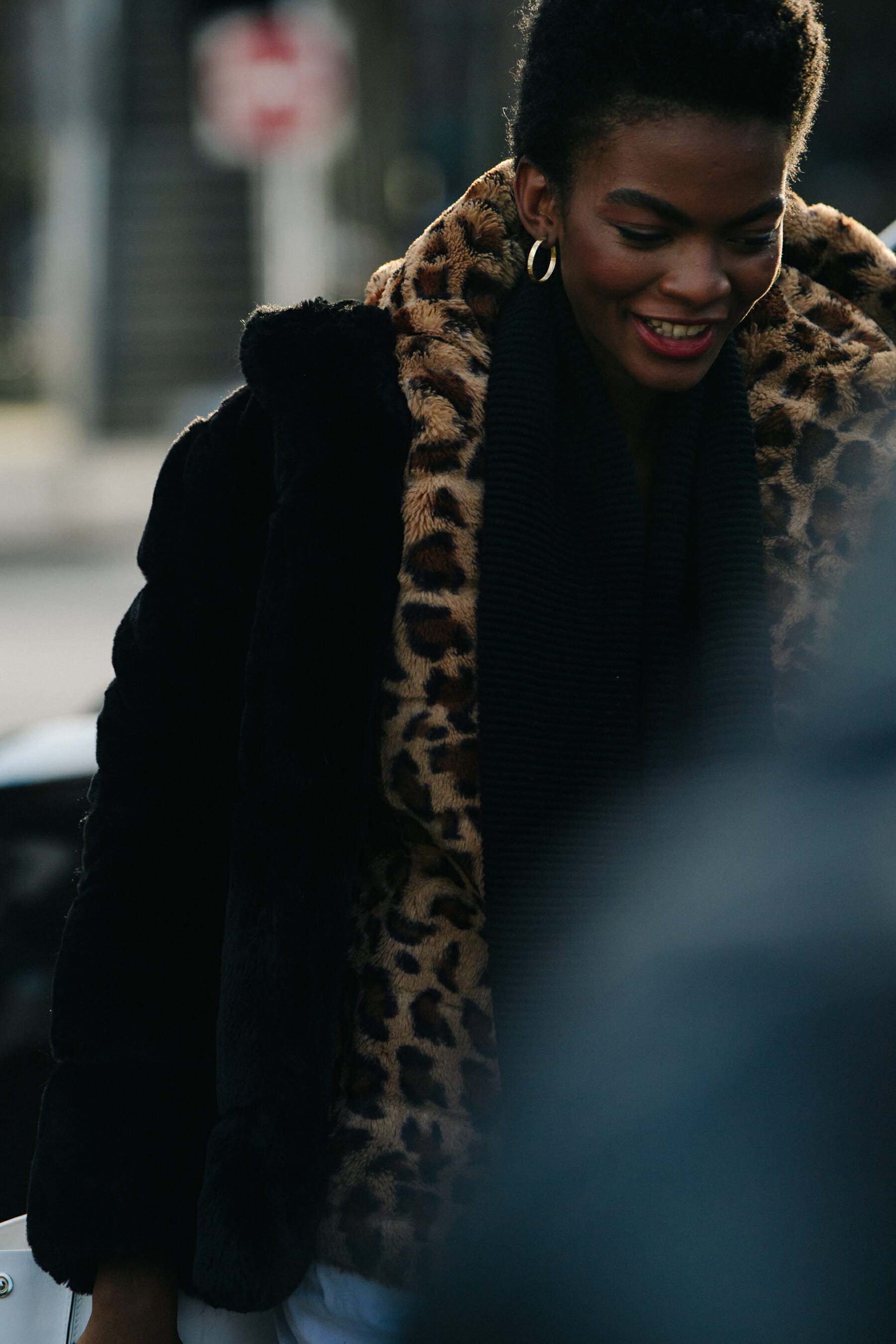Model wearing leopard print fur coat