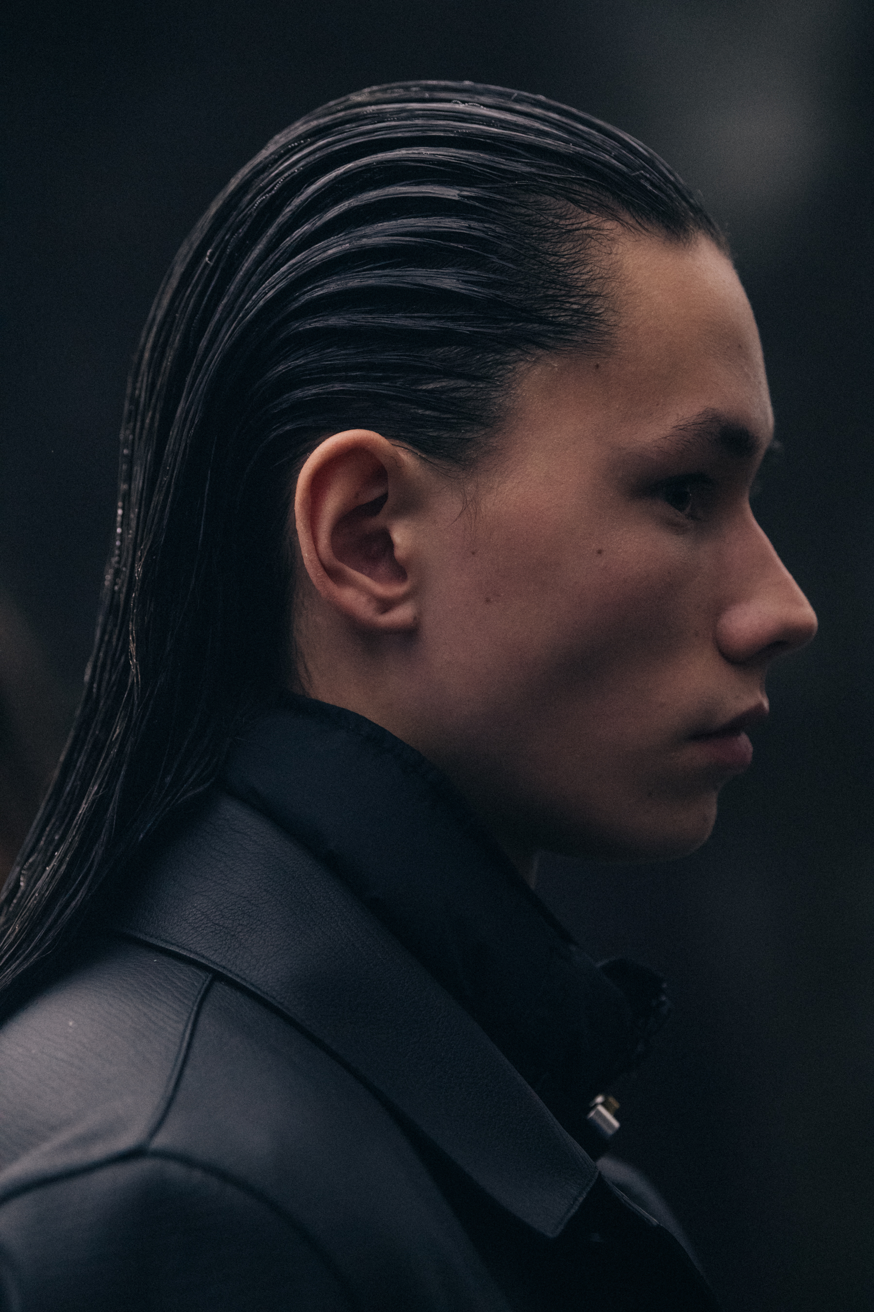 Model wearing dark outfit backstage at 1017 ALYX 9SM