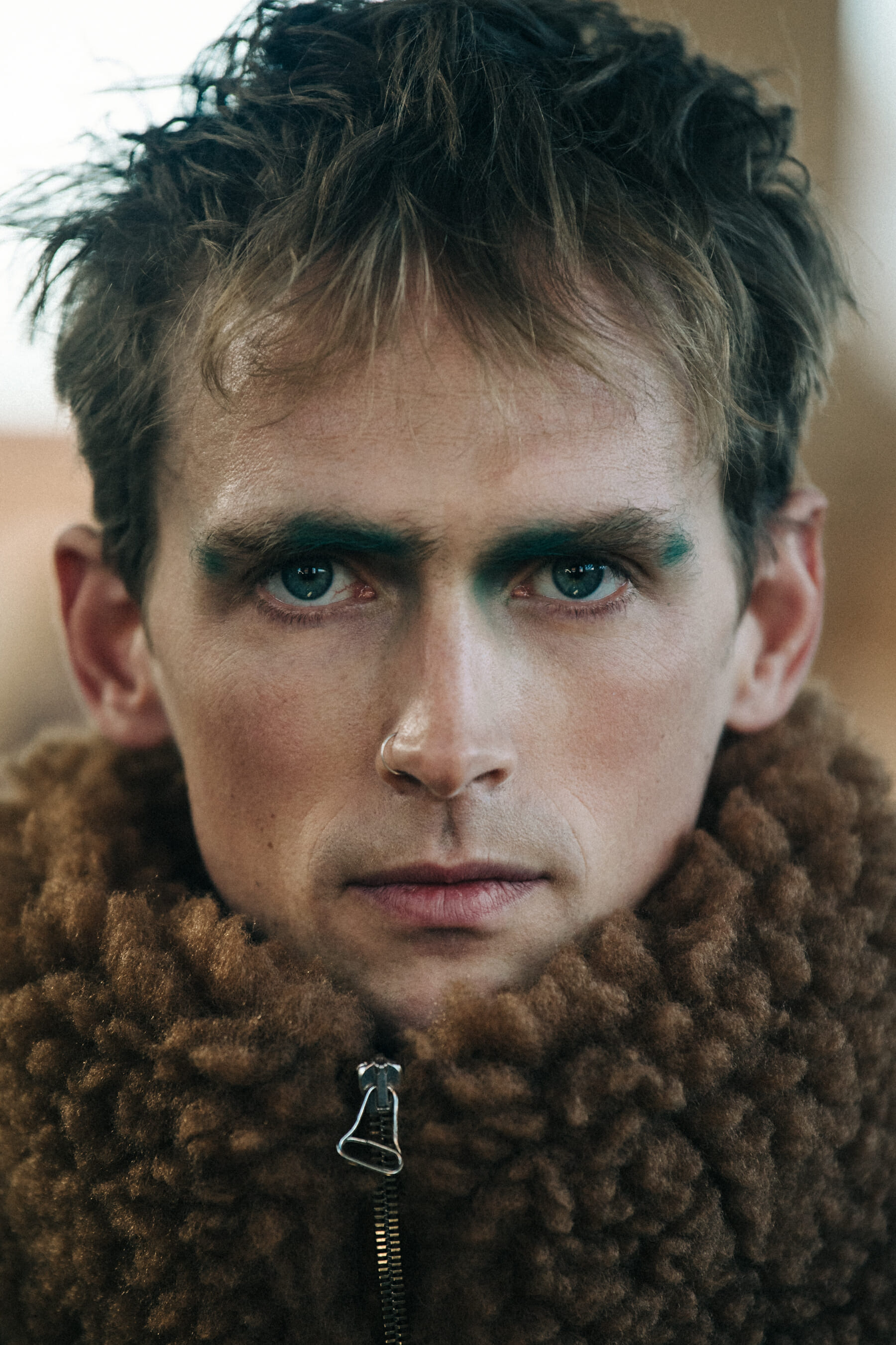 Portrait of model wearing colourful makeup