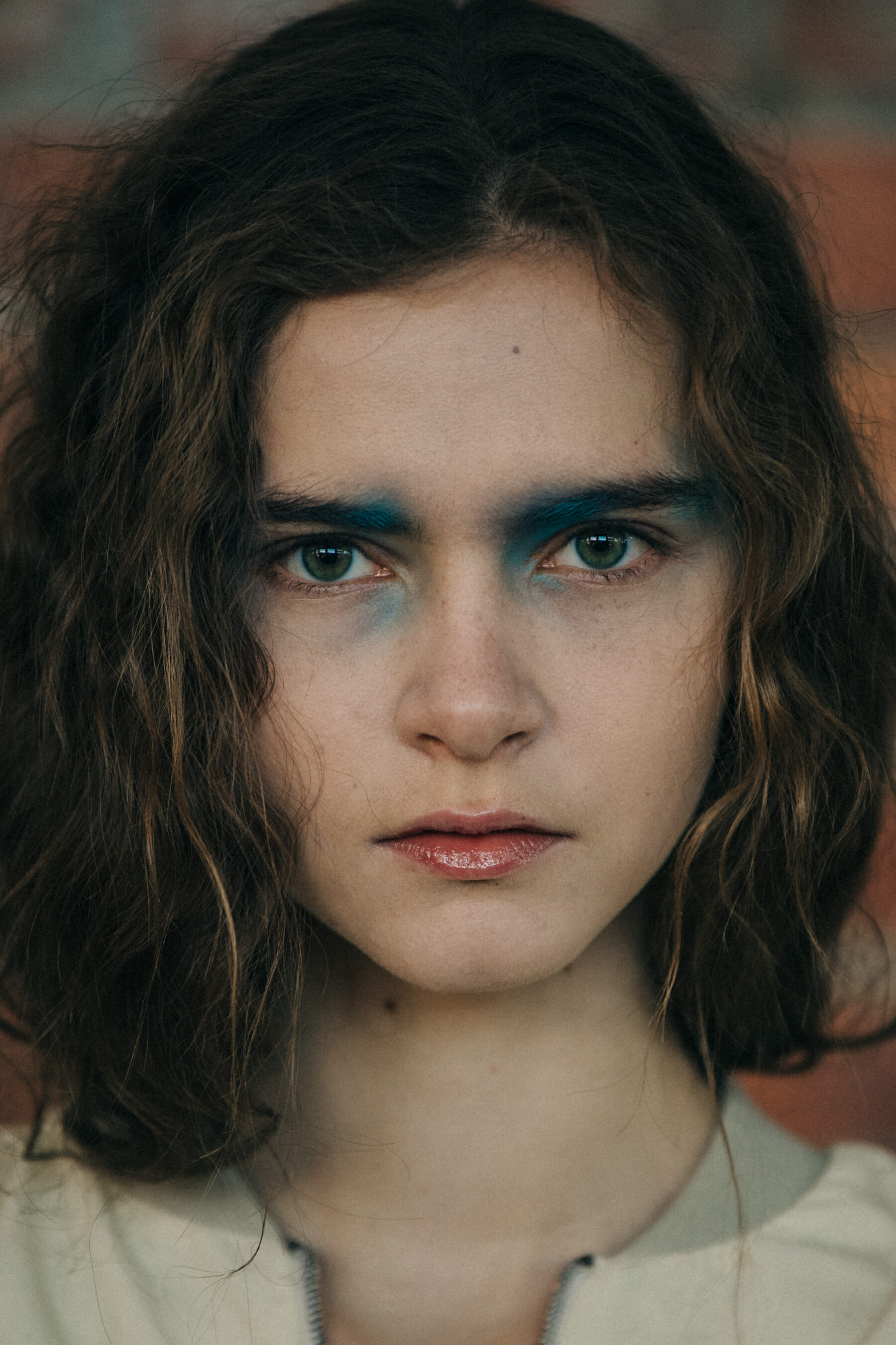 Portrait of model wearing colourful makeup