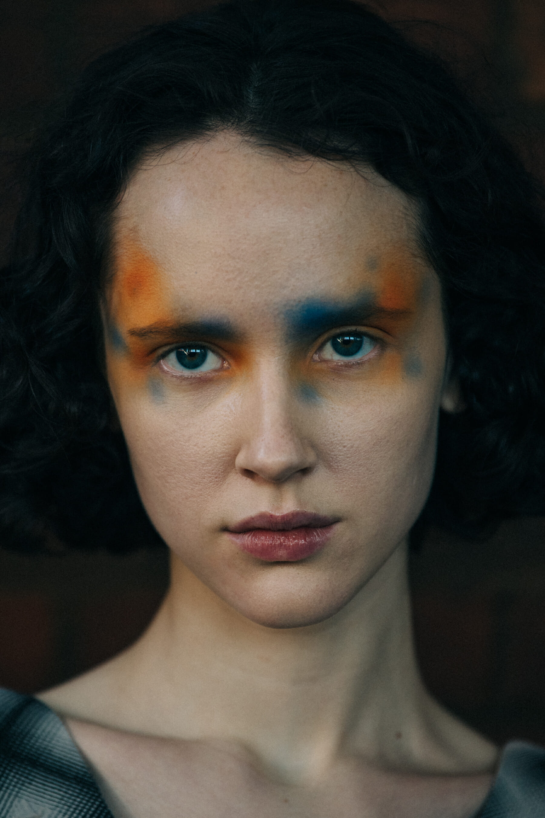 Portrait of model wearing colourful makeup