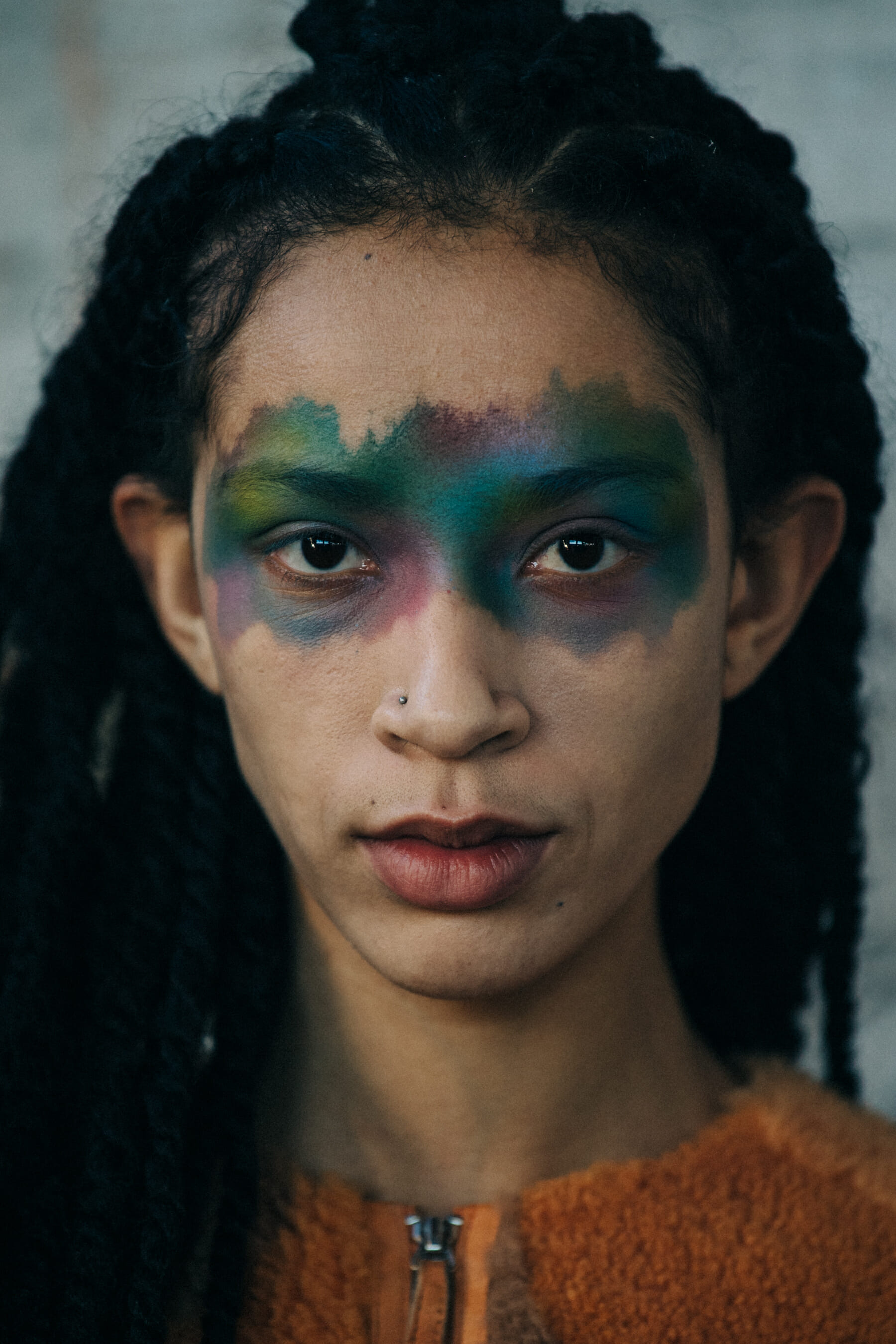 Portrait of model wearing colourful makeup