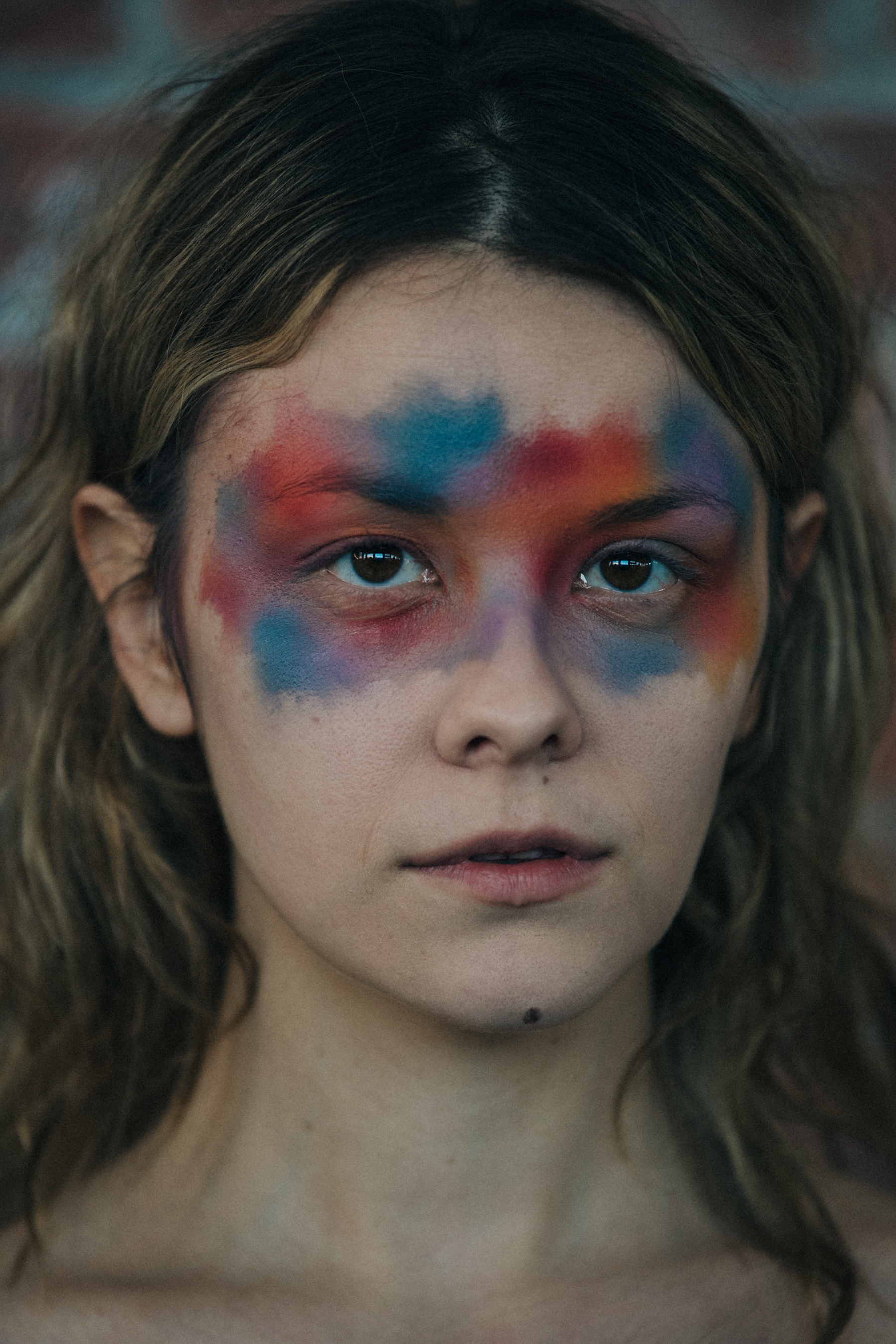 Portrait of model wearing colourful makeup