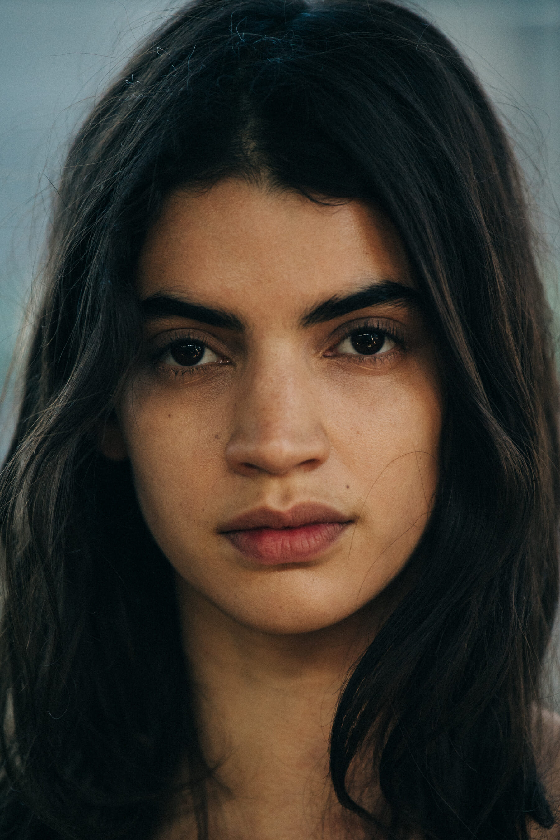 Portrait of model with long dark hair