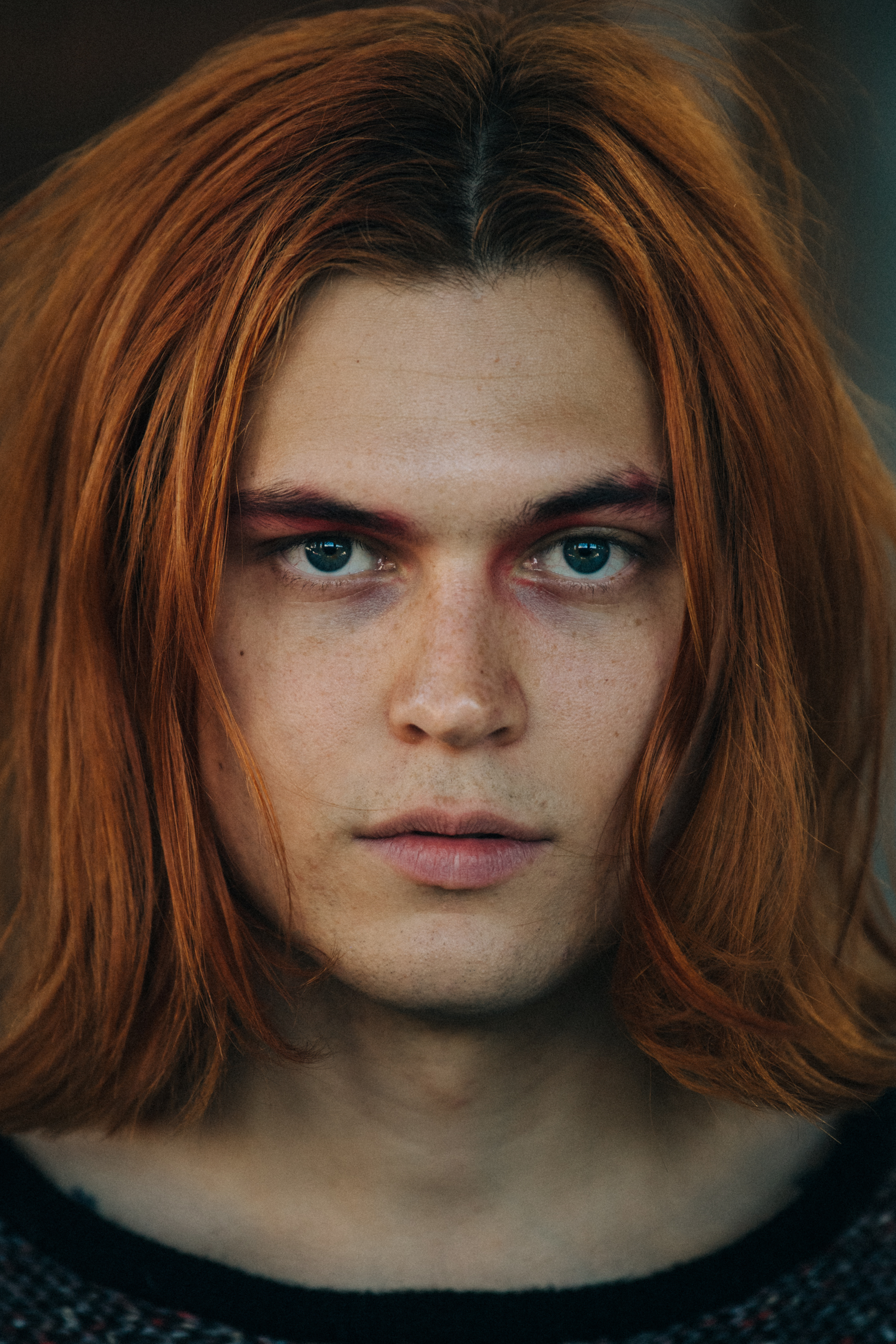 Portrait of model wearing colourful makeup