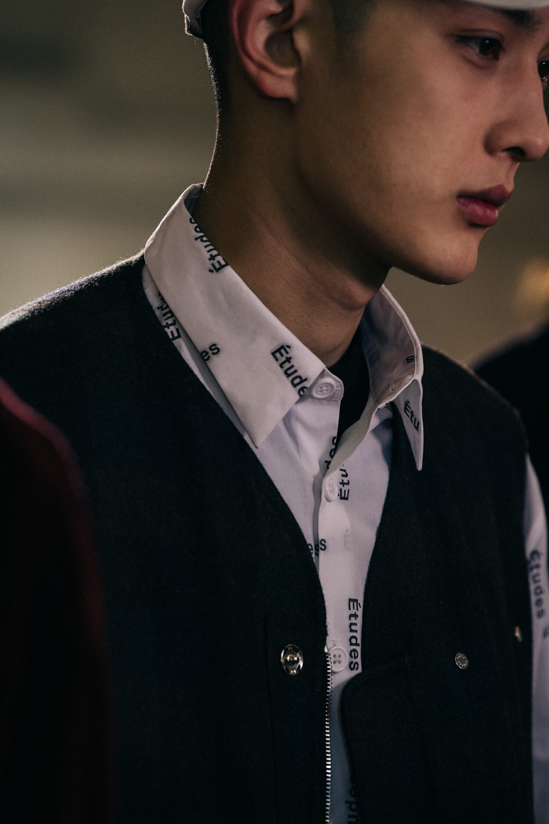 Models wearing dark outfits at Etudes