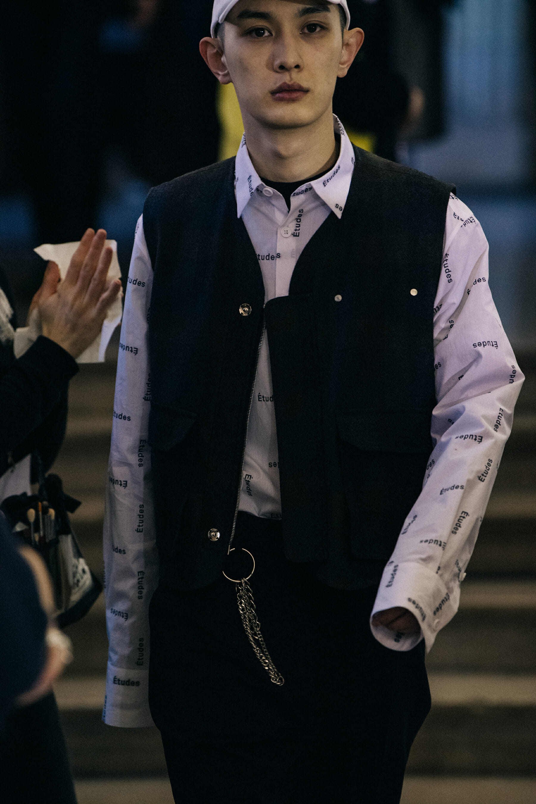 Models wearing dark outfits at Etudes