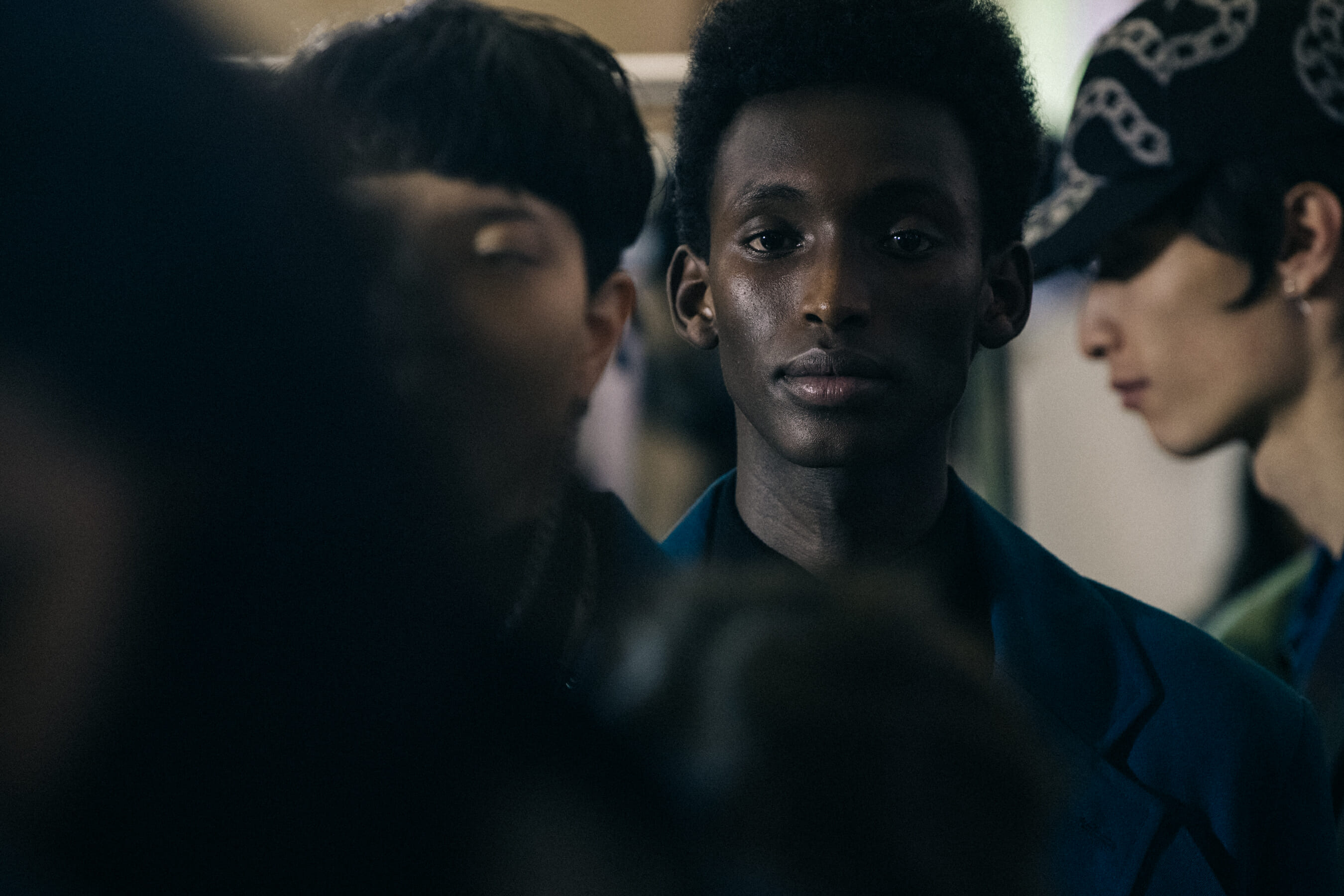 Model wearing dark blue backstage