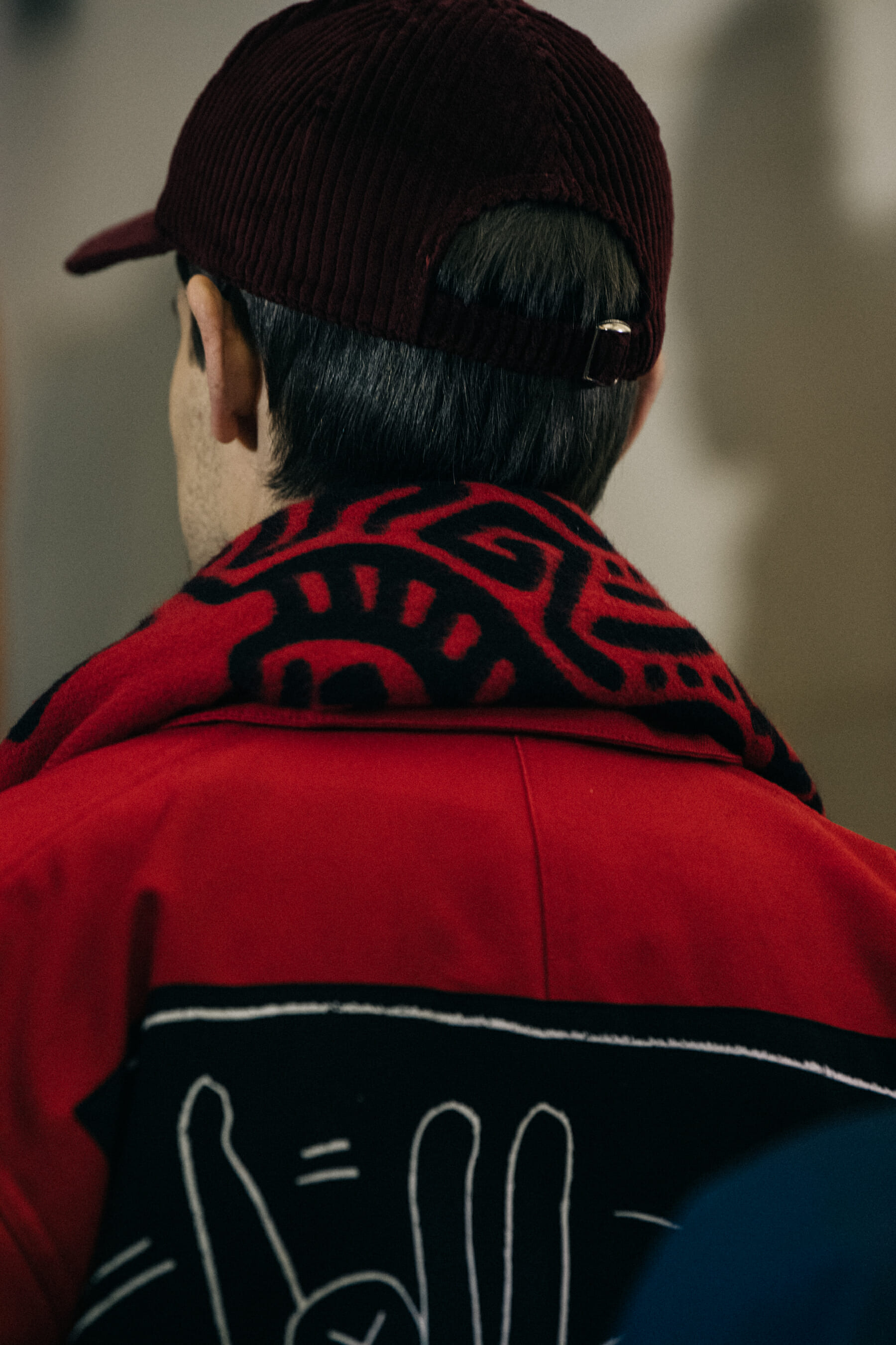 Model wearing red outfit at Etudes