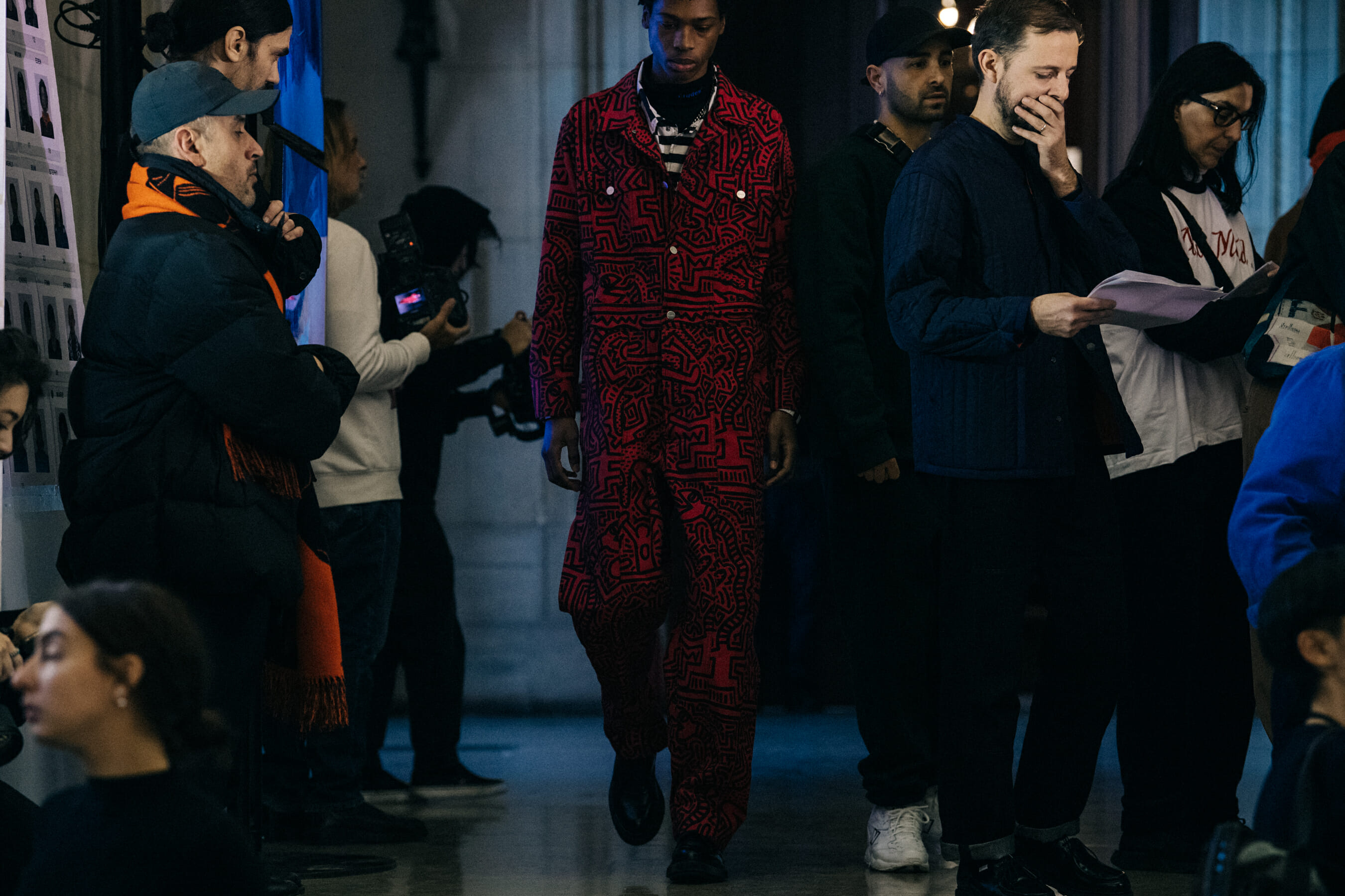 Model wearing red outfit at Etudes