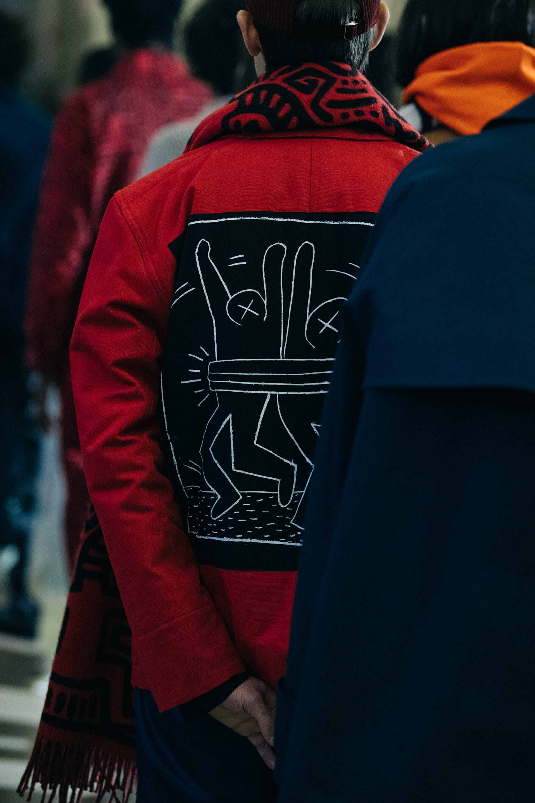 Model wearing red outfit at Etudes