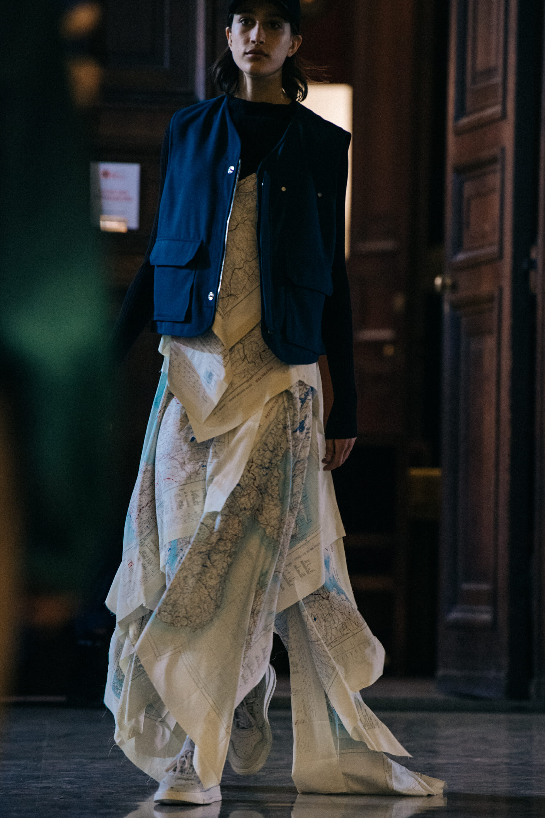 Model wearing dark blue backstage