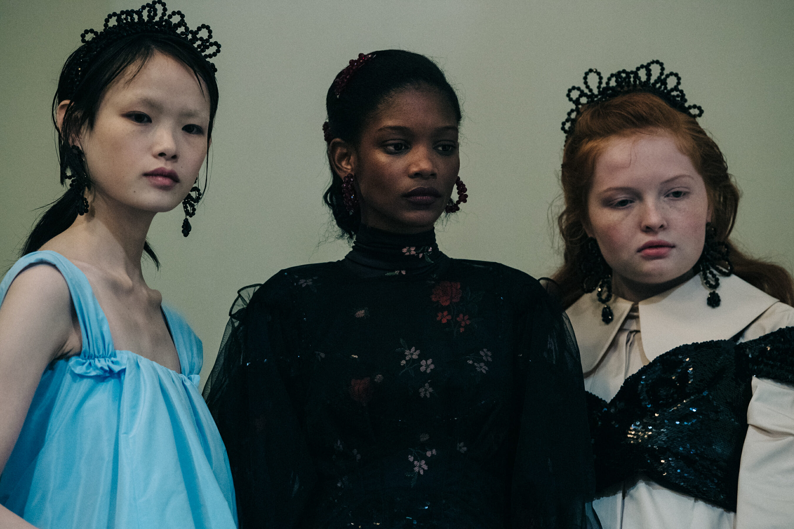 Models wearing colourful dresses at Simone Rocha