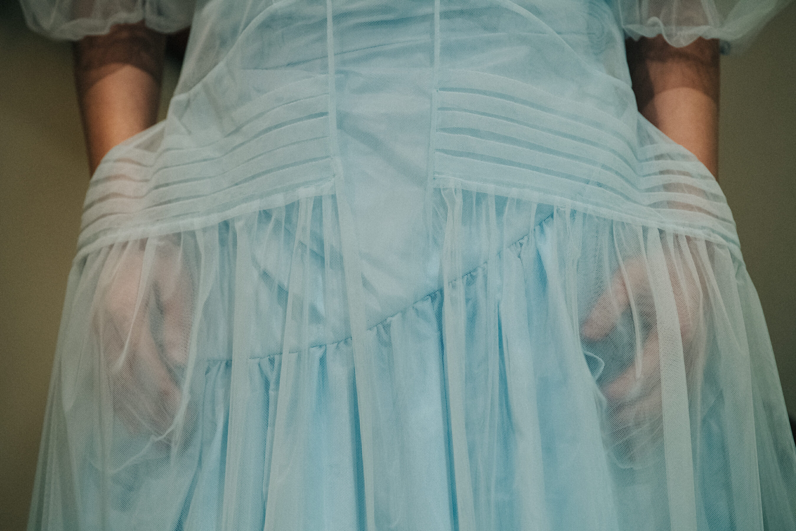 Model wearing blue dress backstage at Simone Rocha