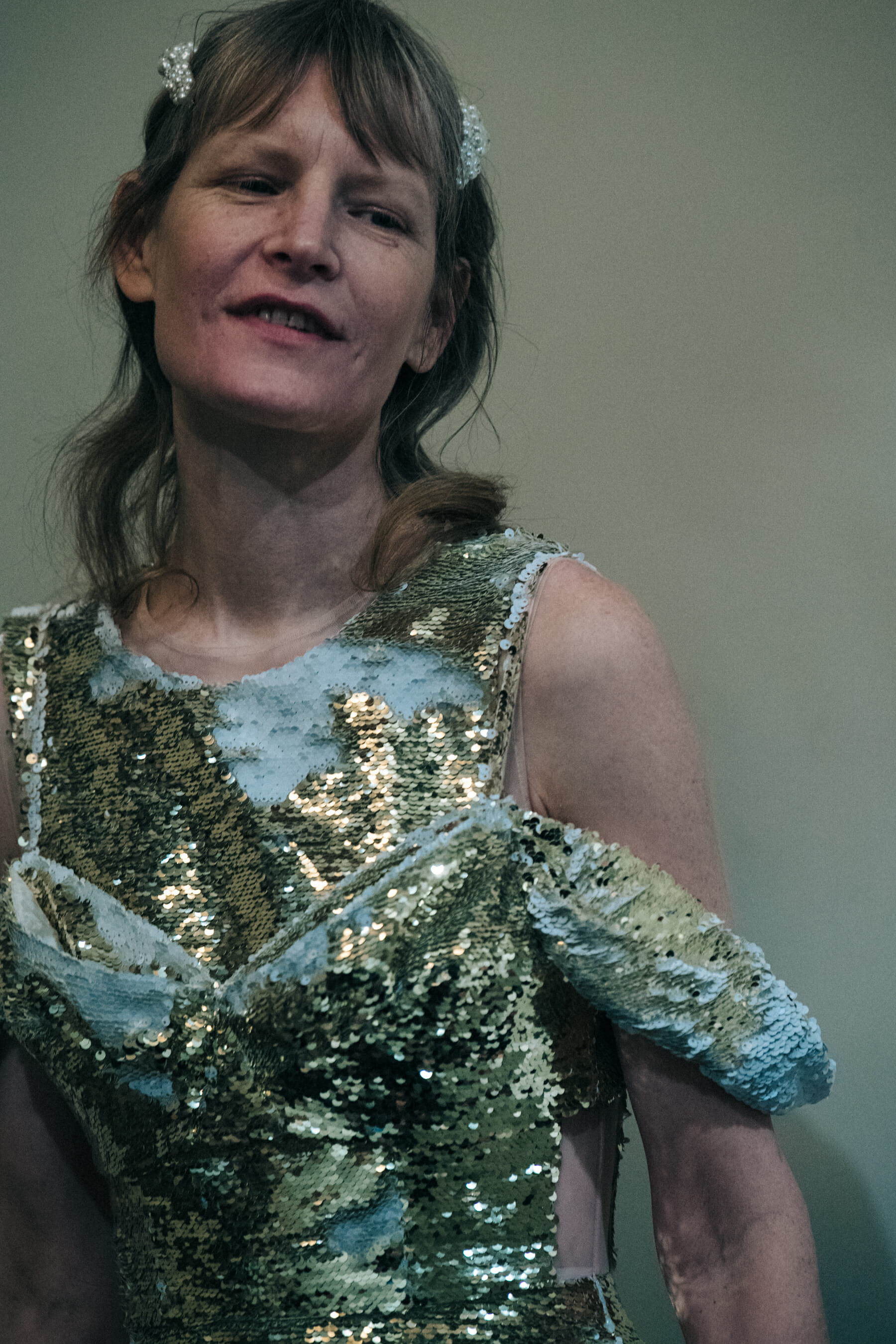 Model wearing gold dress at Simone Rocha