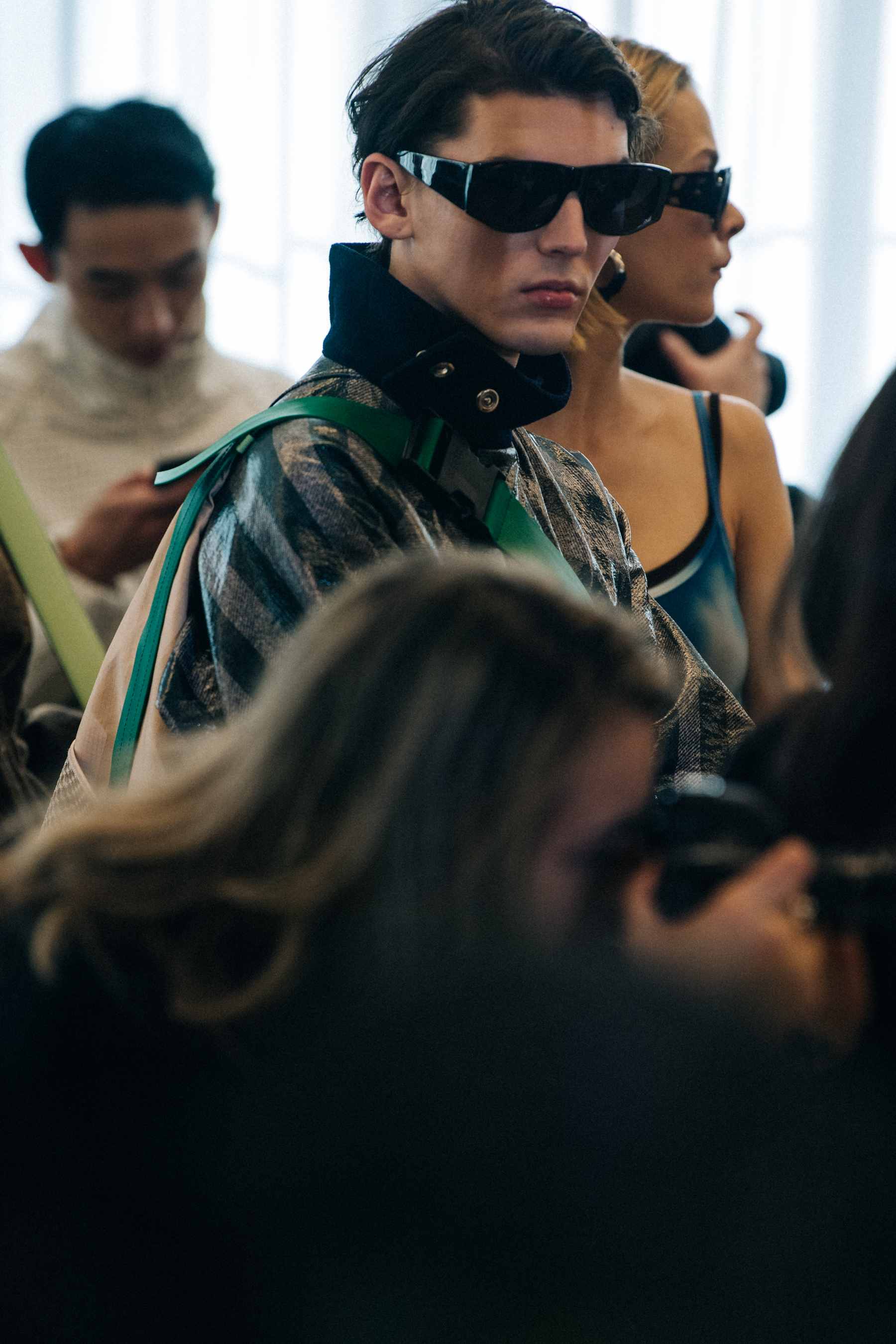 Model wearing stripes backstage
