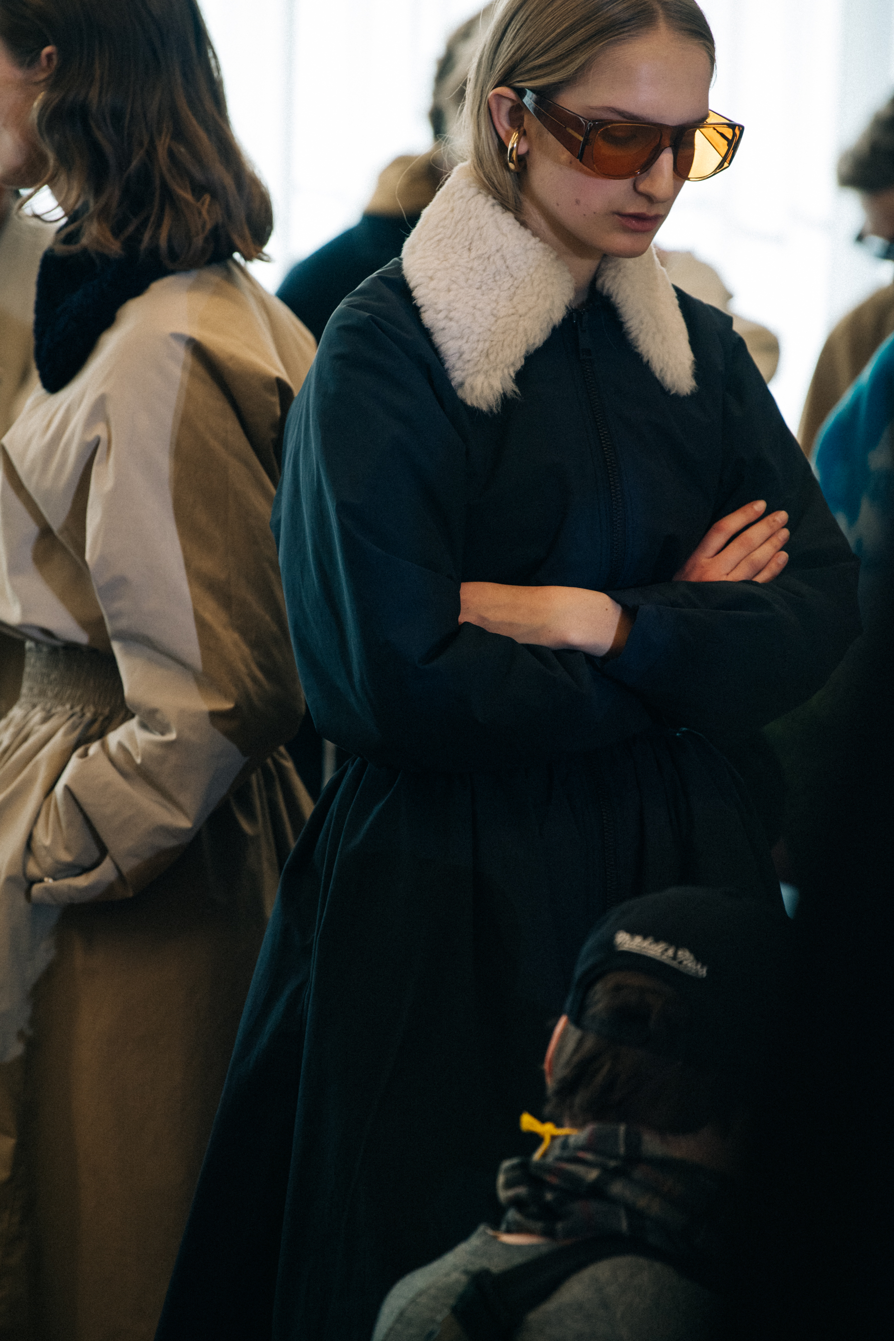 Model wearing fur backstage at Sunnei