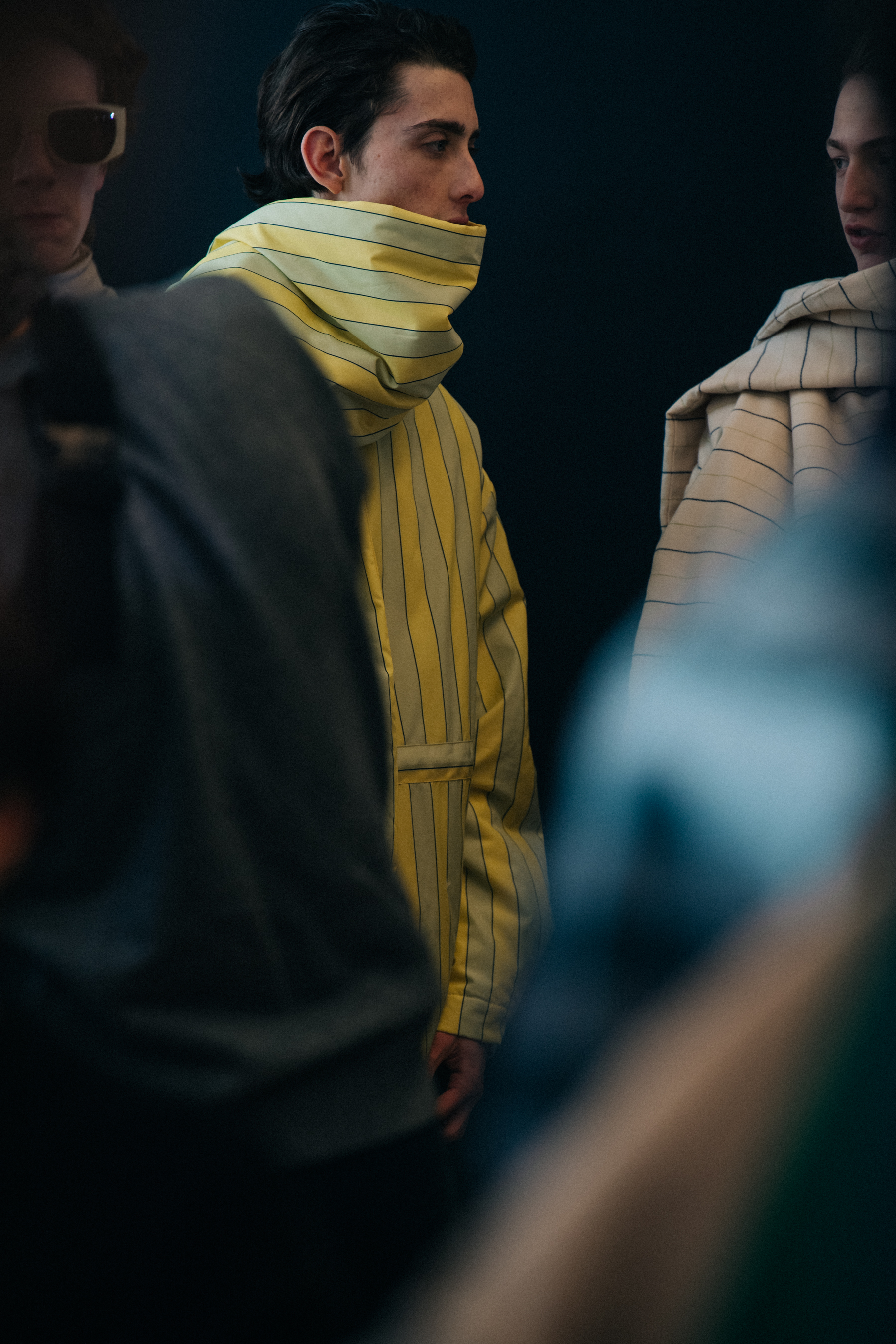 Model wearing stripes backstage
