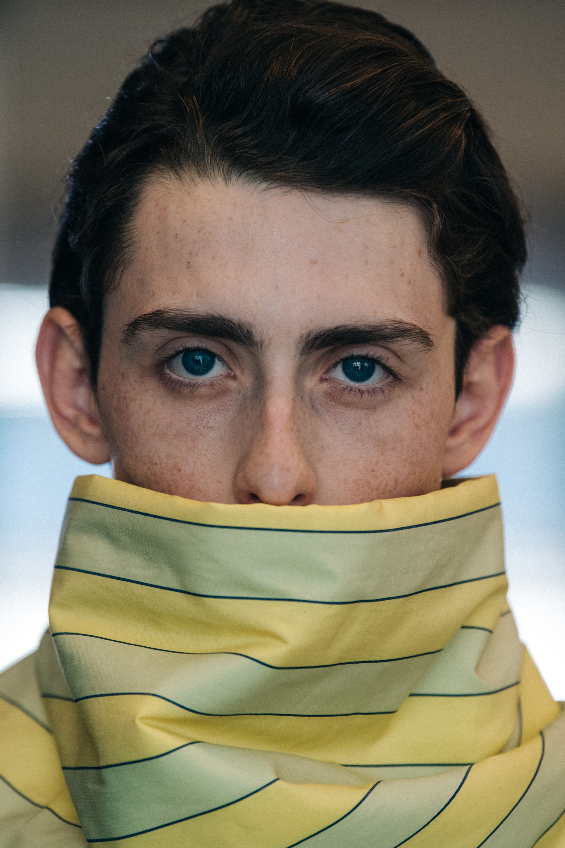 Portrait of model wearing high neck top