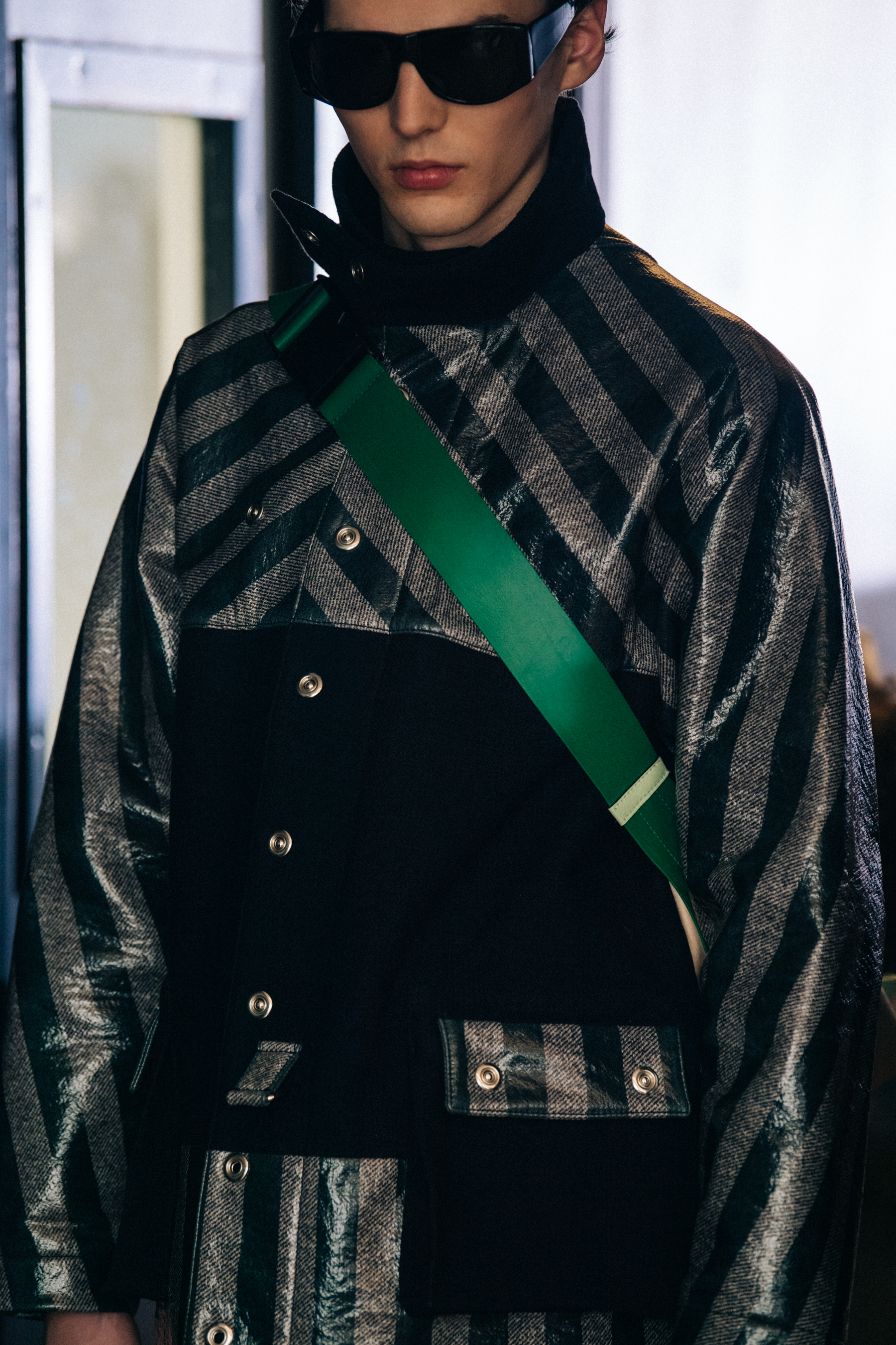 Model wearing stripes backstage