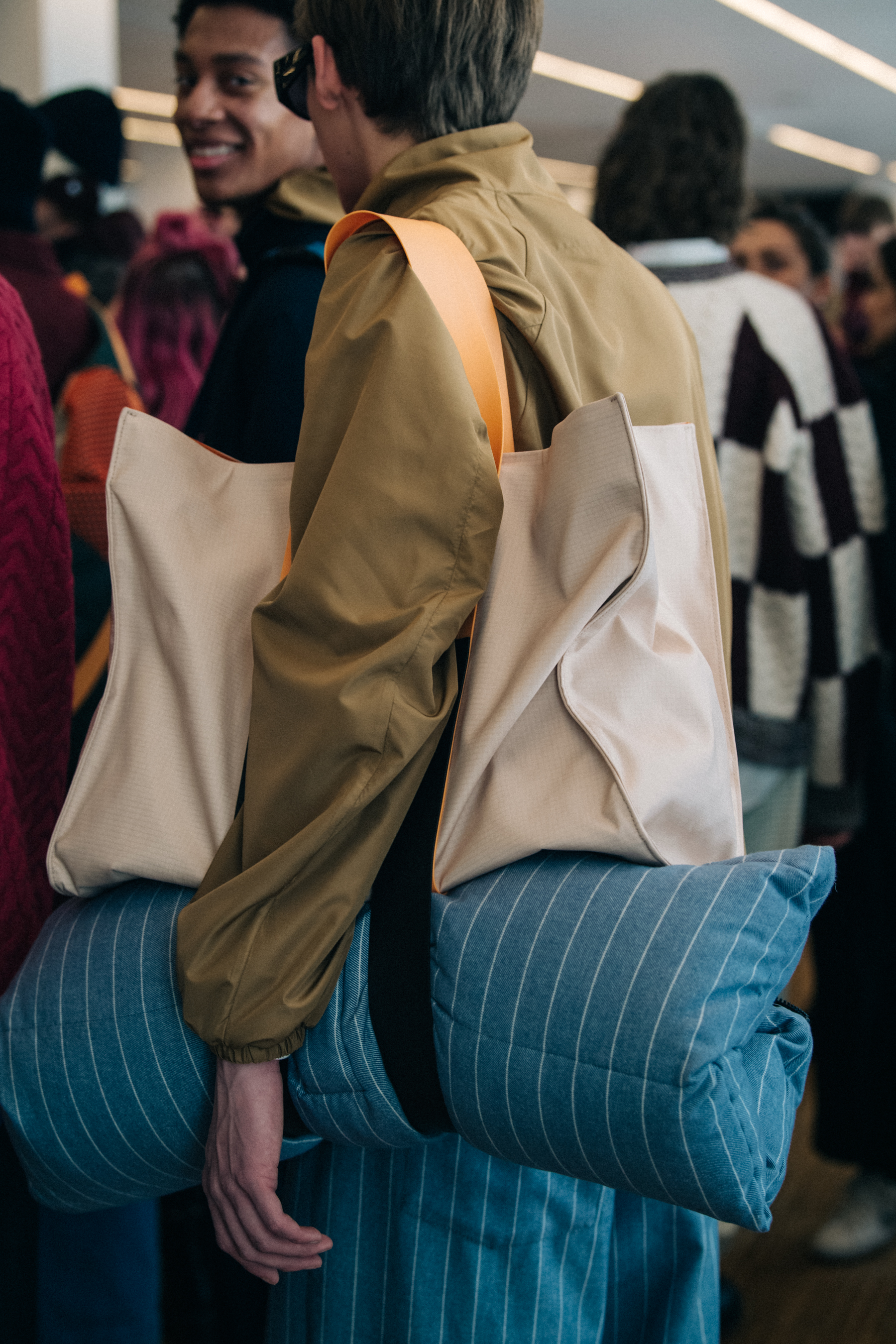 Model wearing stripes backstage