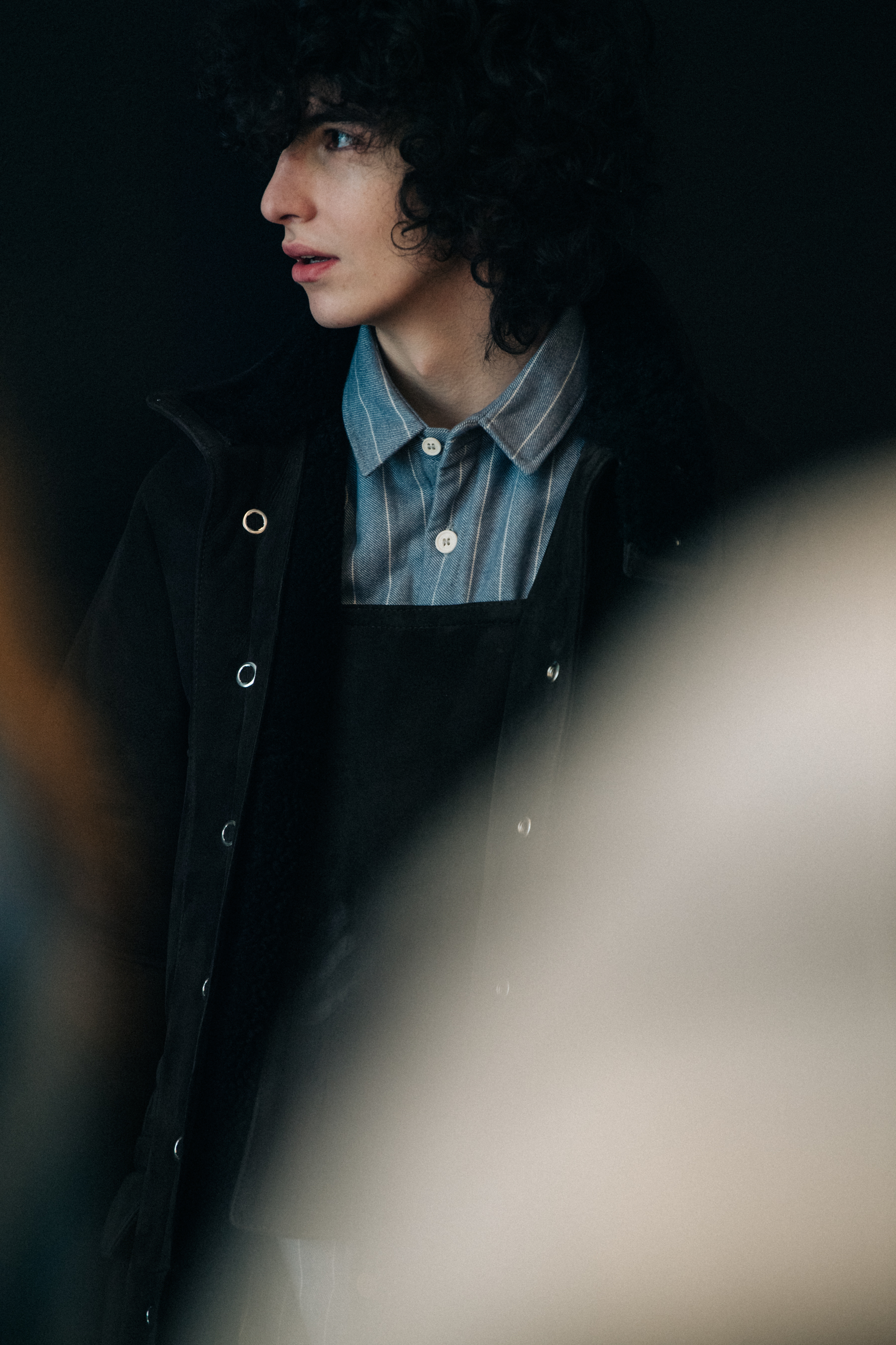 Model wearing stripes backstage