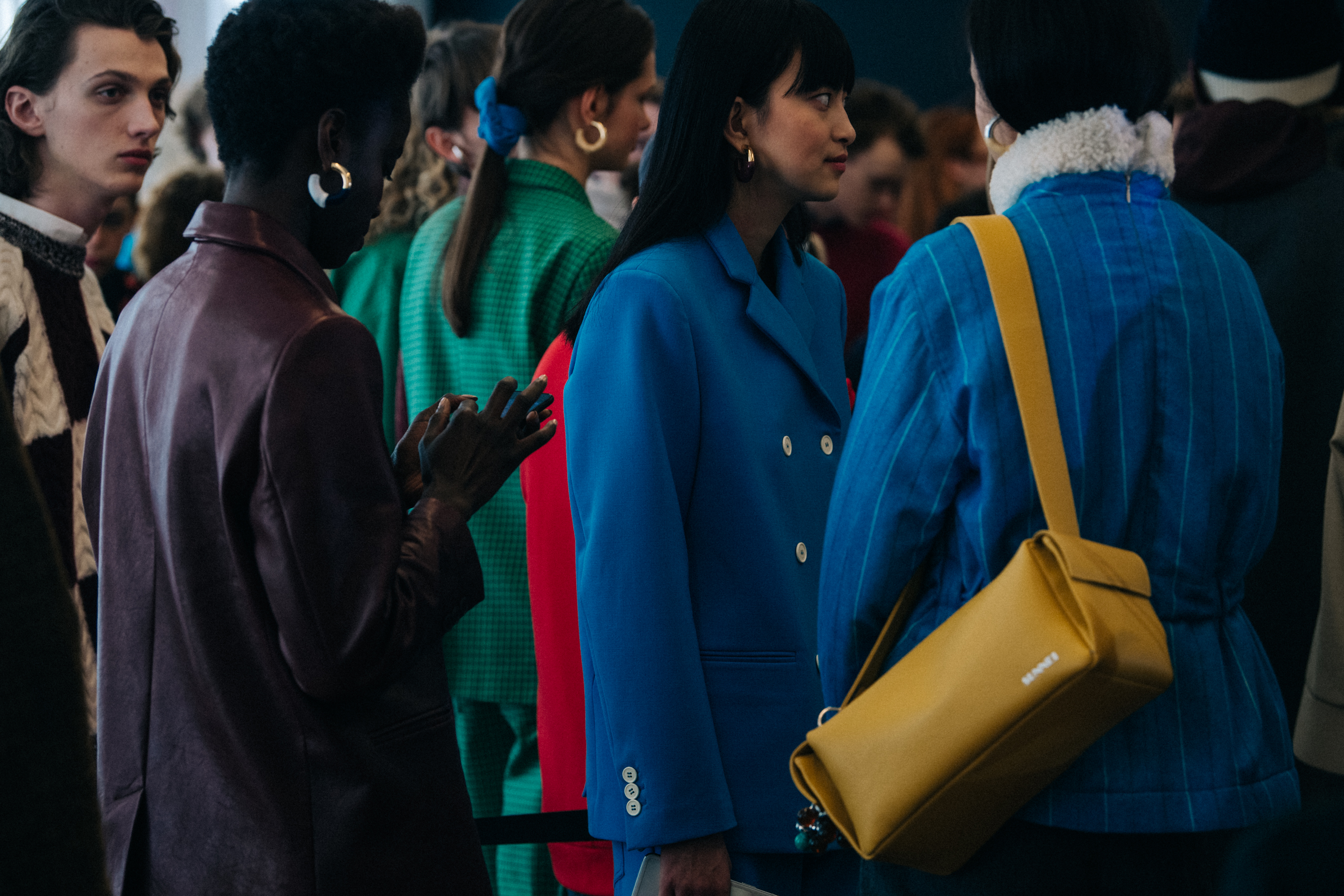 Models wearing colourful Sunnei outfits