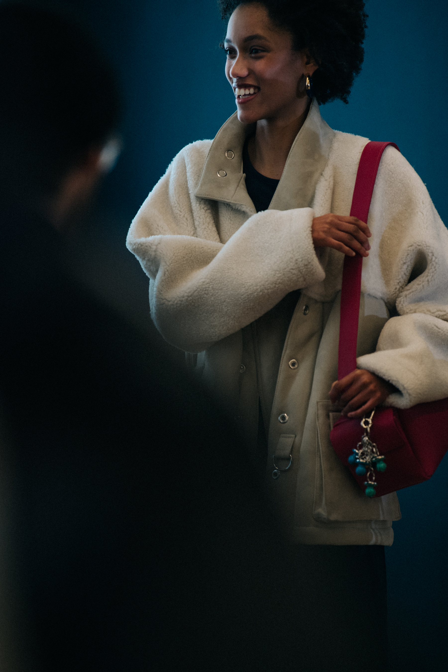 Model wearing fur backstage at Sunnei