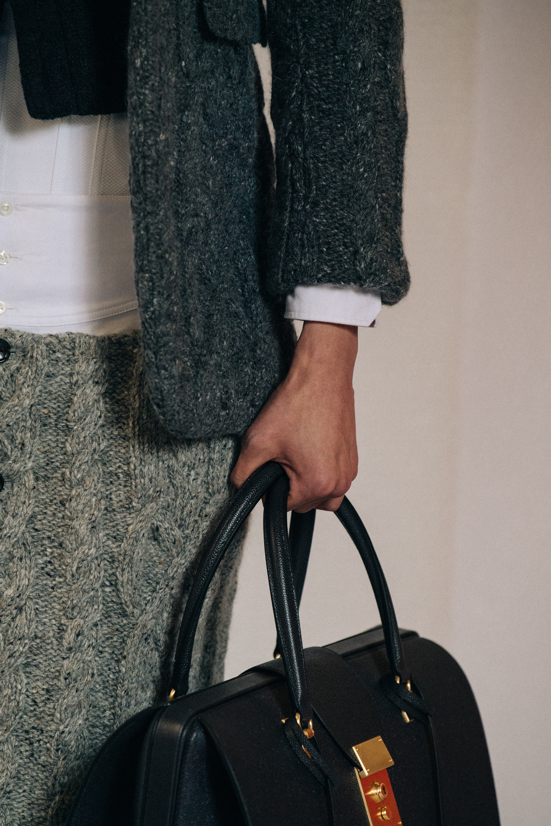Model carrying bag at Thom Browne