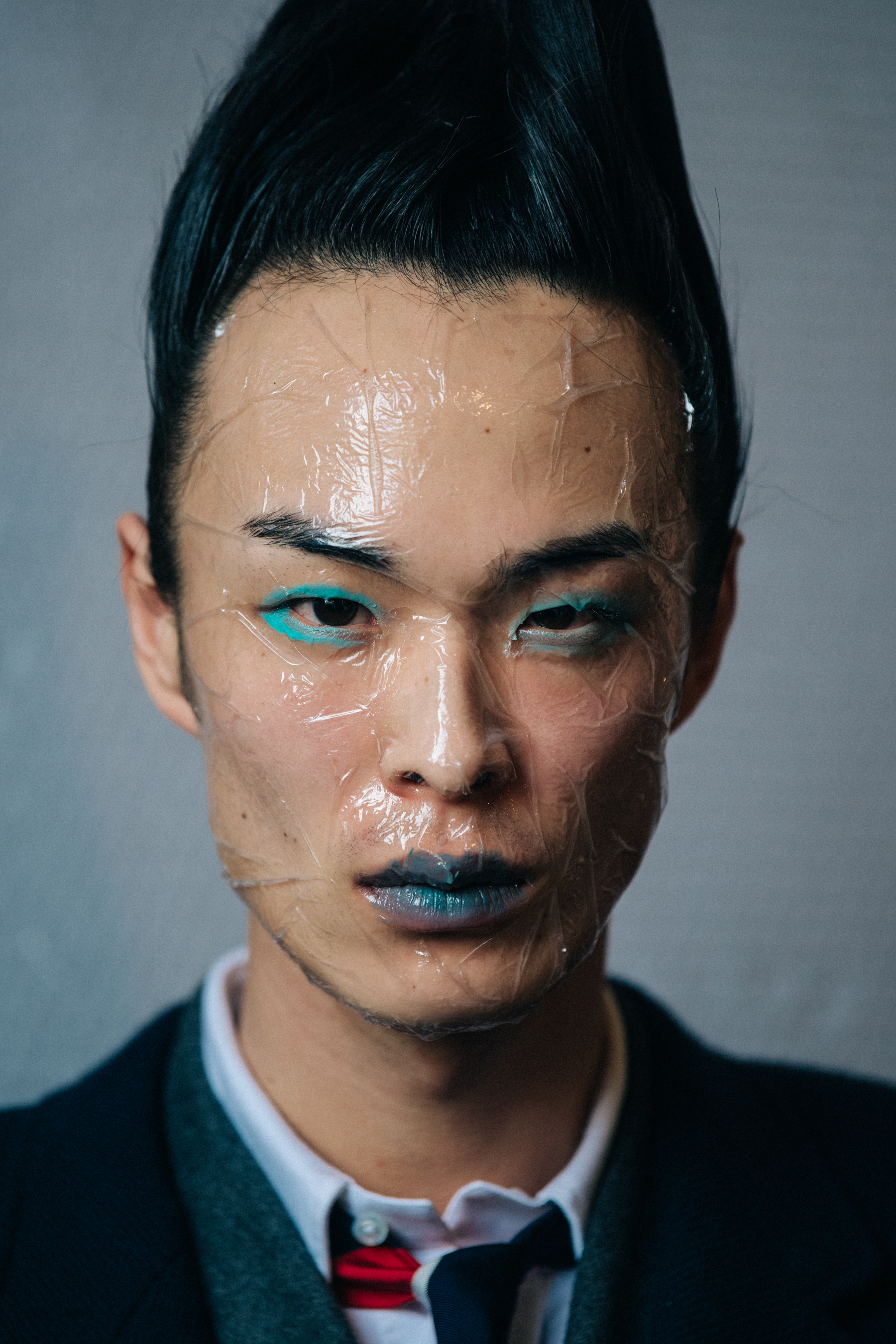 Portrait of model with sticky tape on face