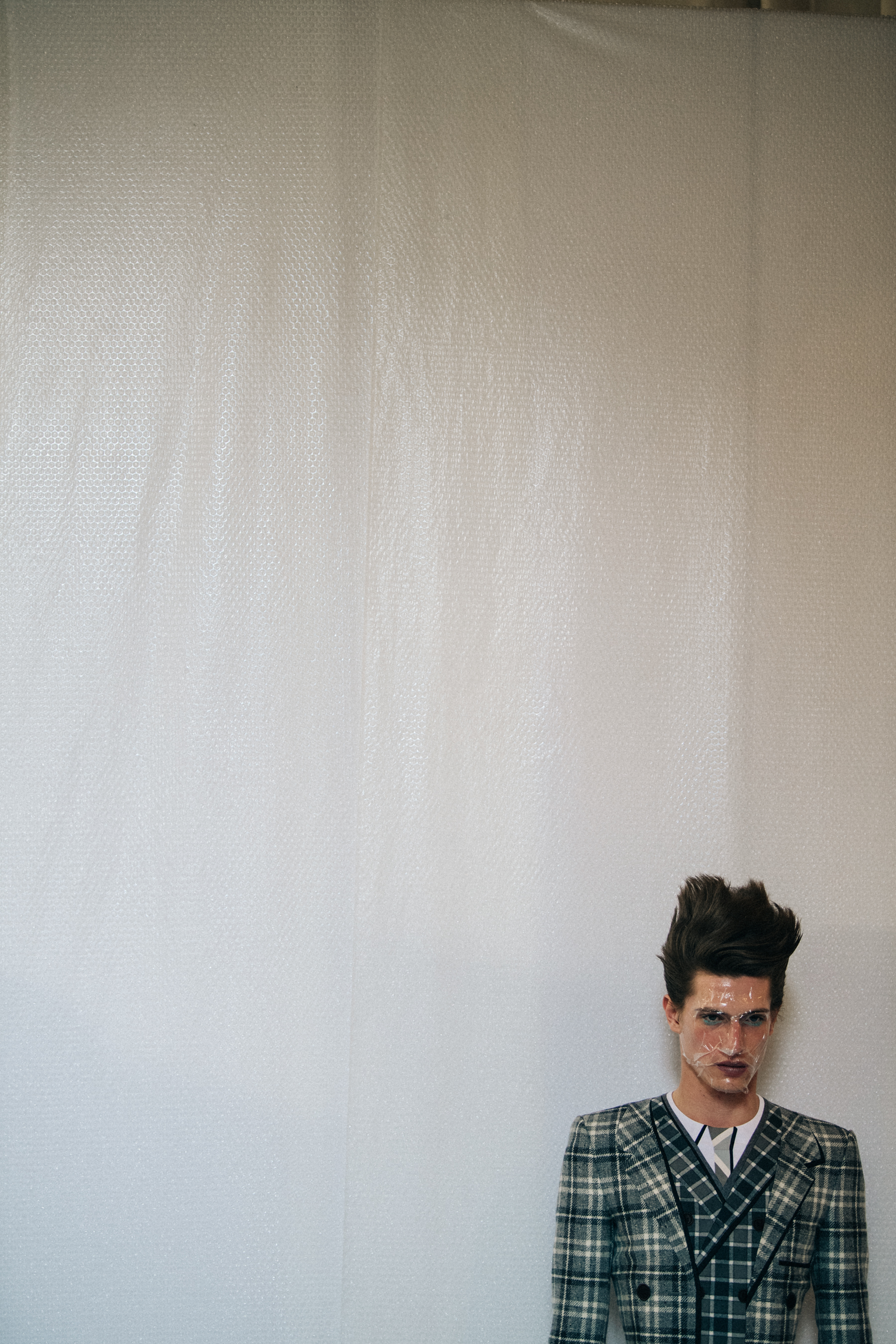 Model wearing Thom Browne suit