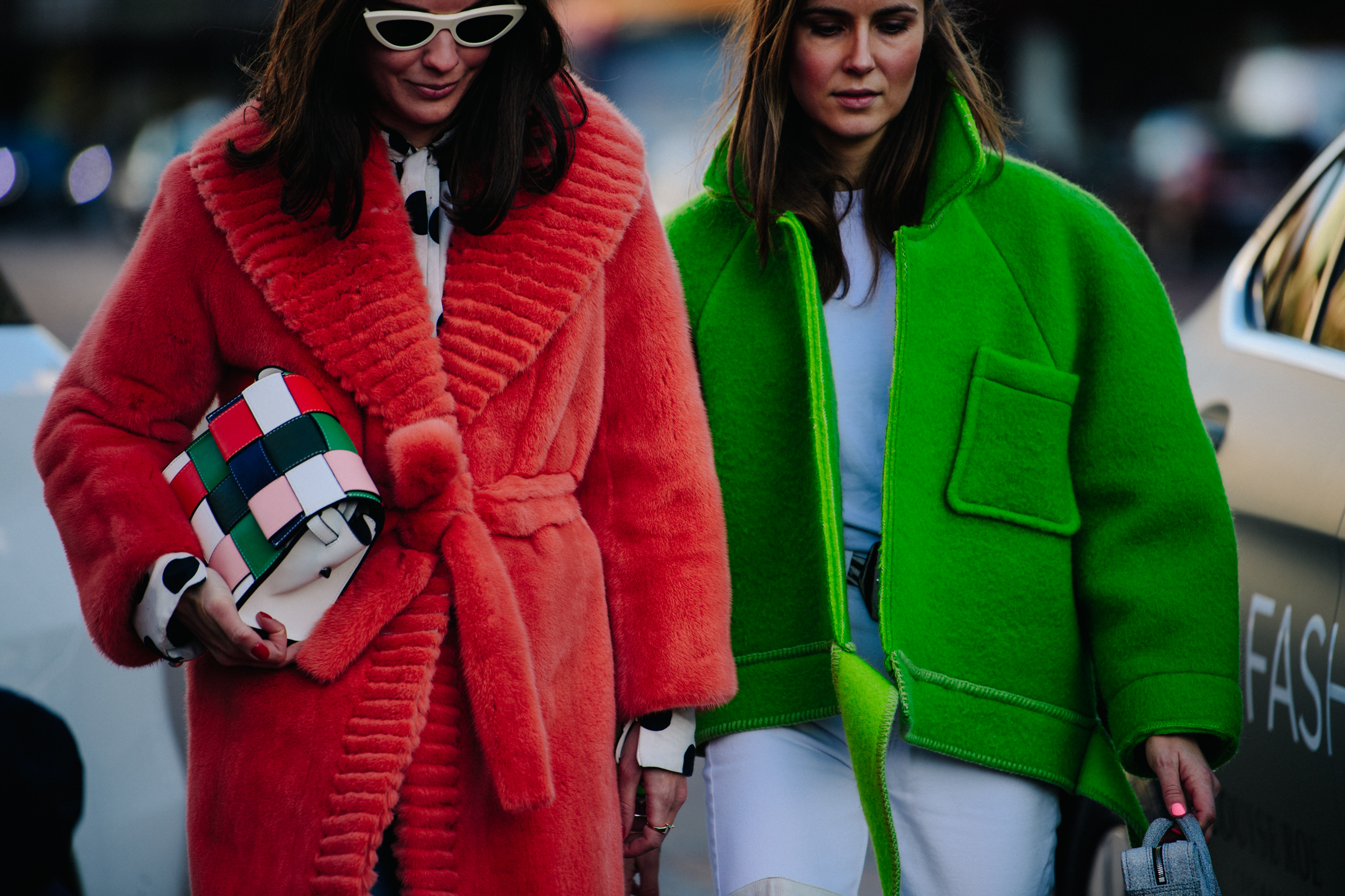 Two women wearing red and green