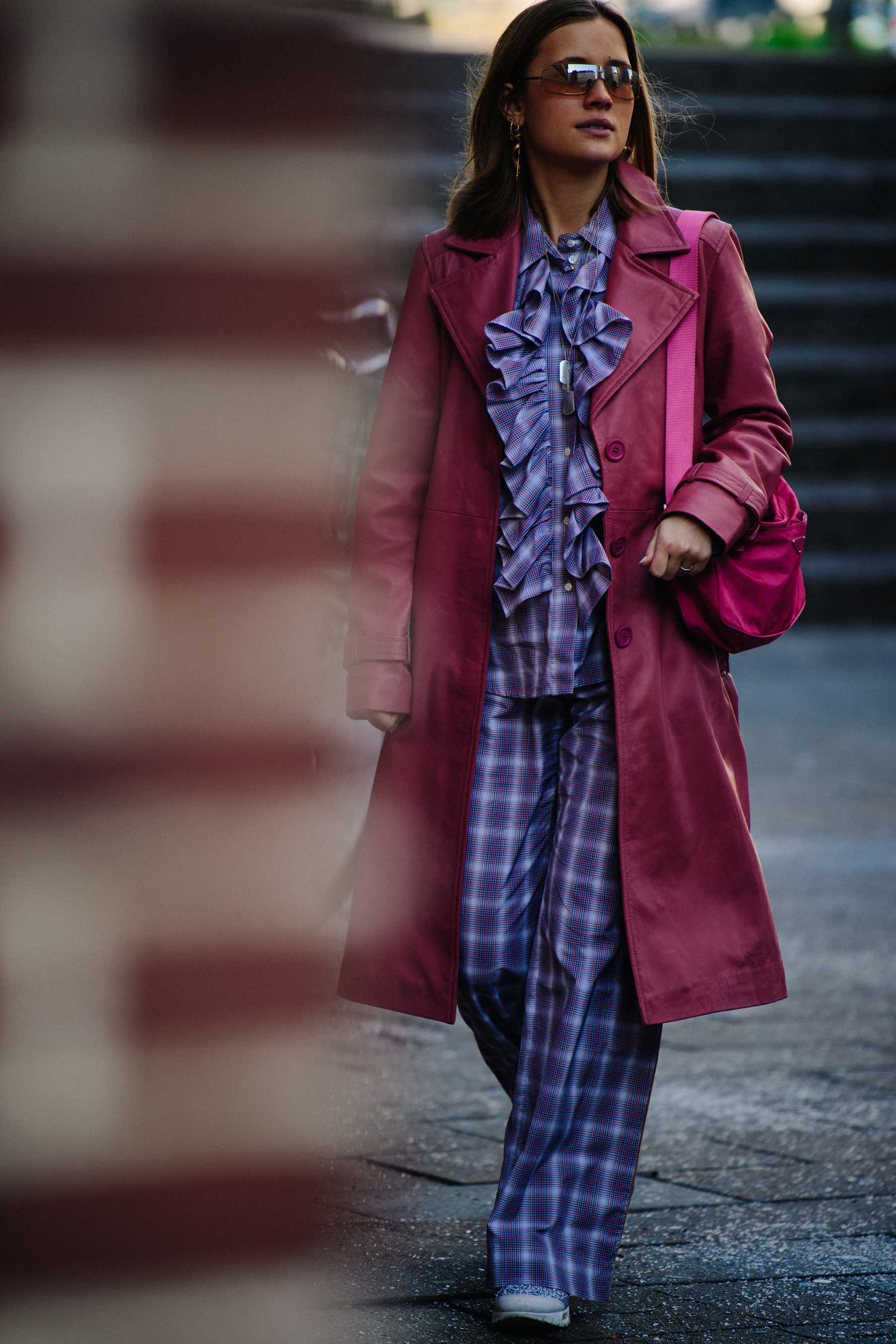Woman wearing long pink coat