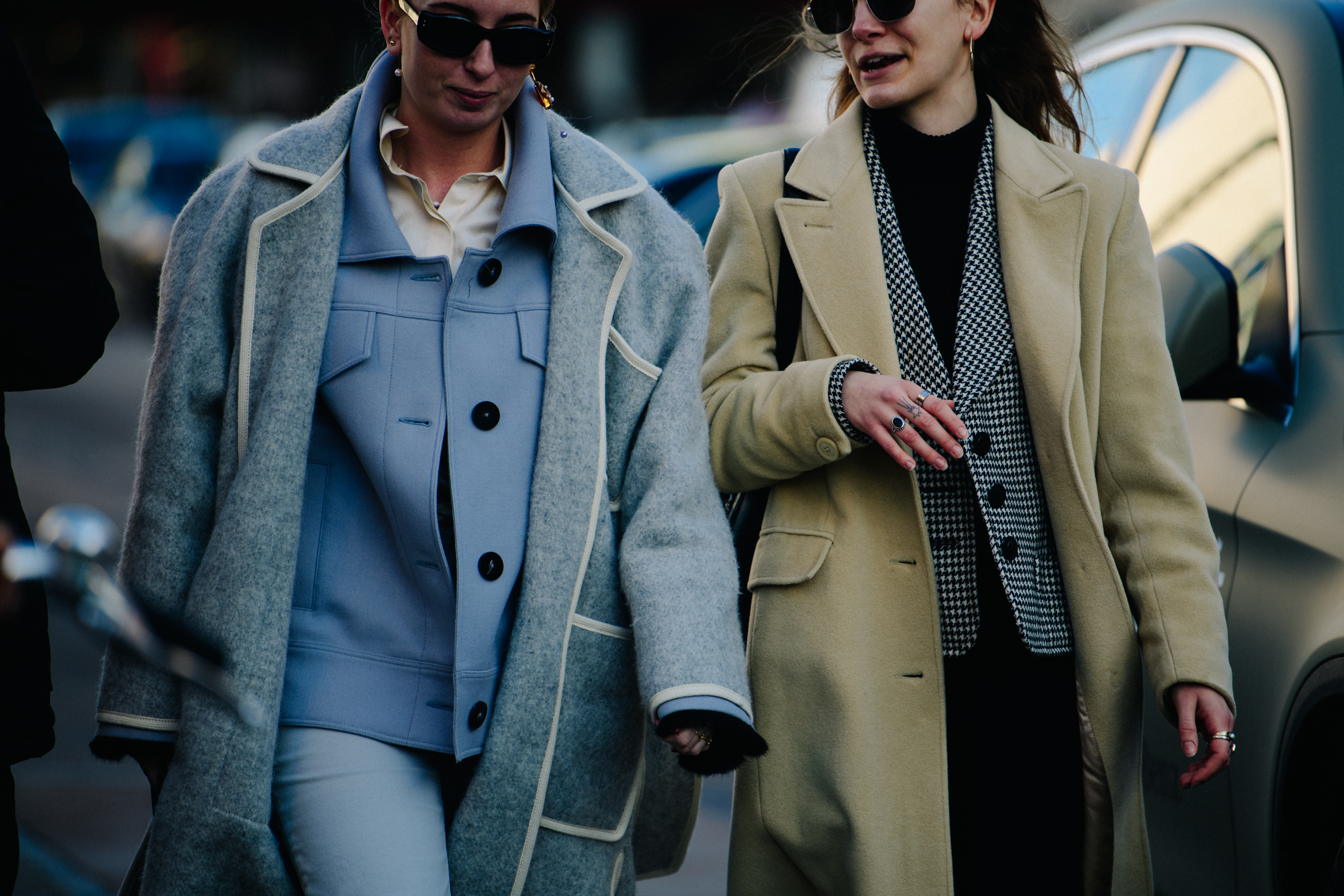 Two women wearing wool coats