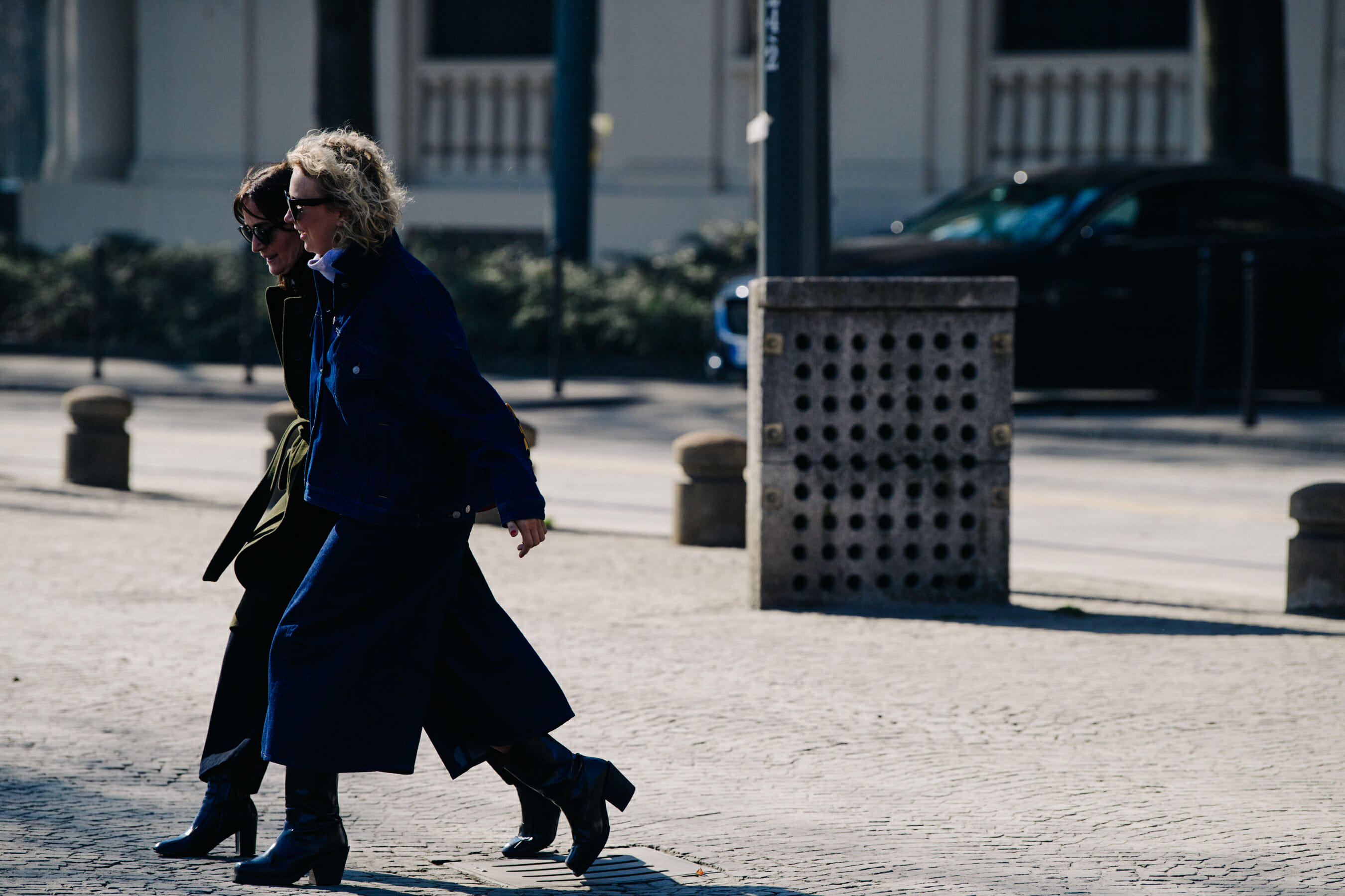 Two women wearing boots